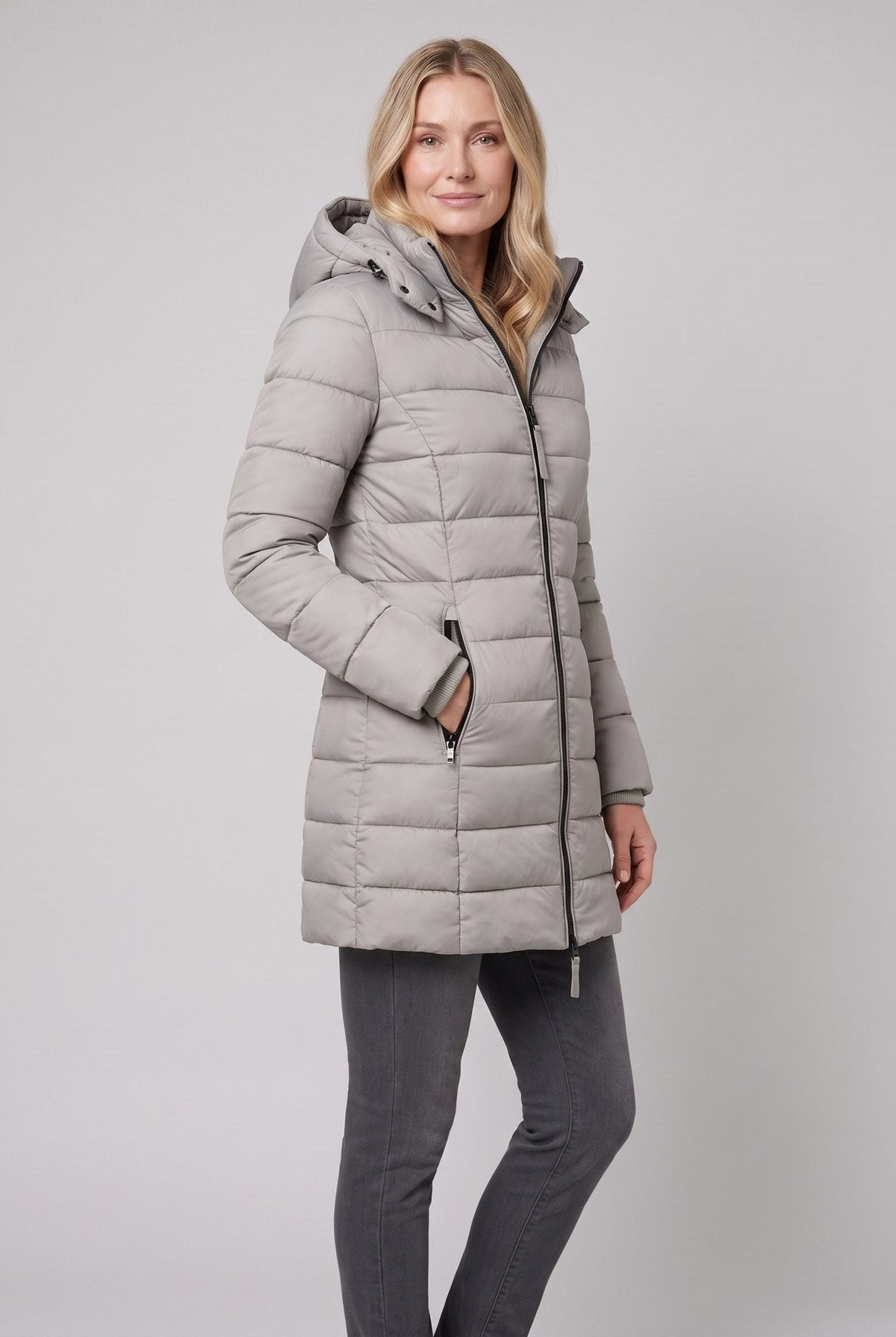 Evara lightweight hooded puffer jacket in grey on model