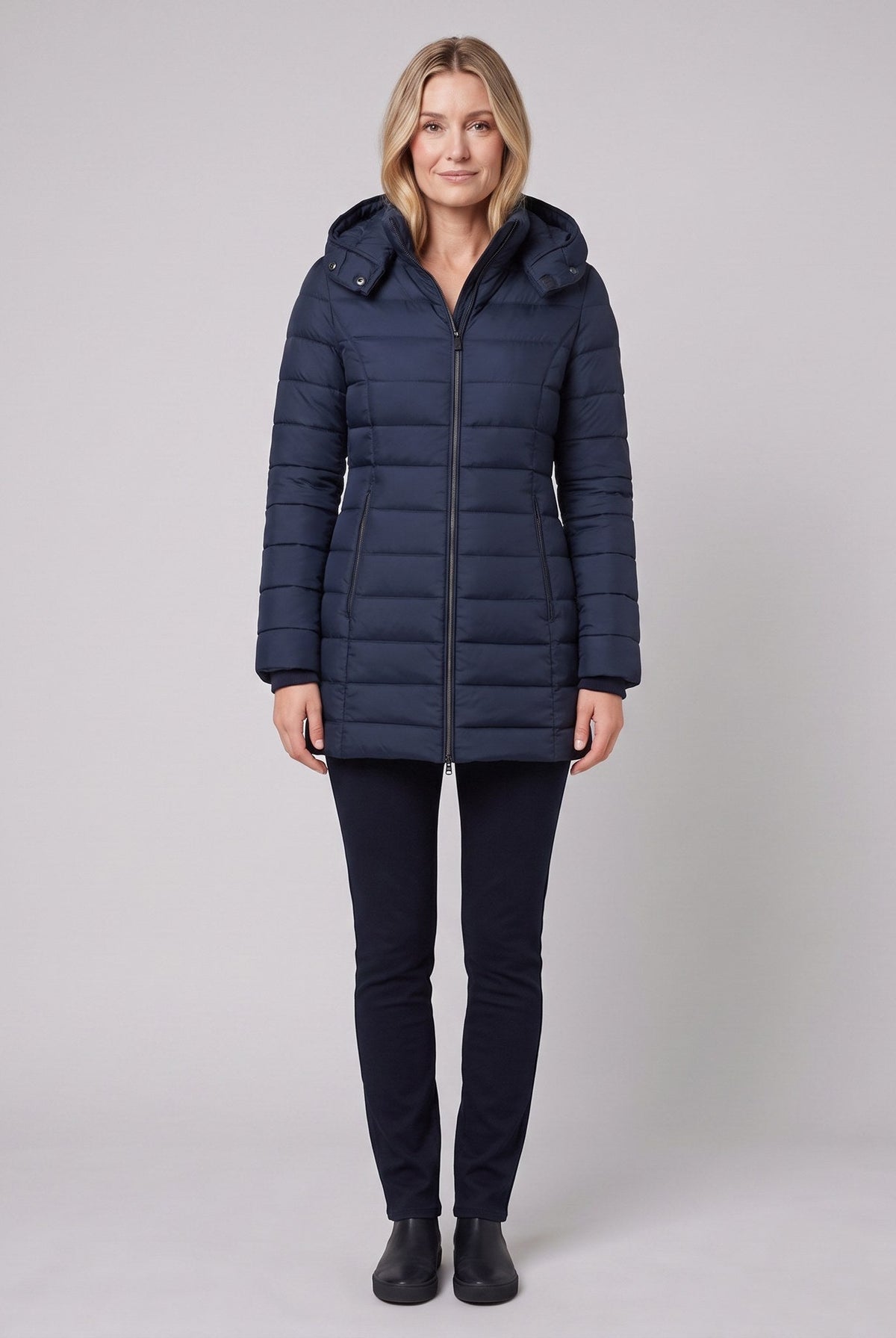 Evara lightweight hooded puffer jacket in navy on model
