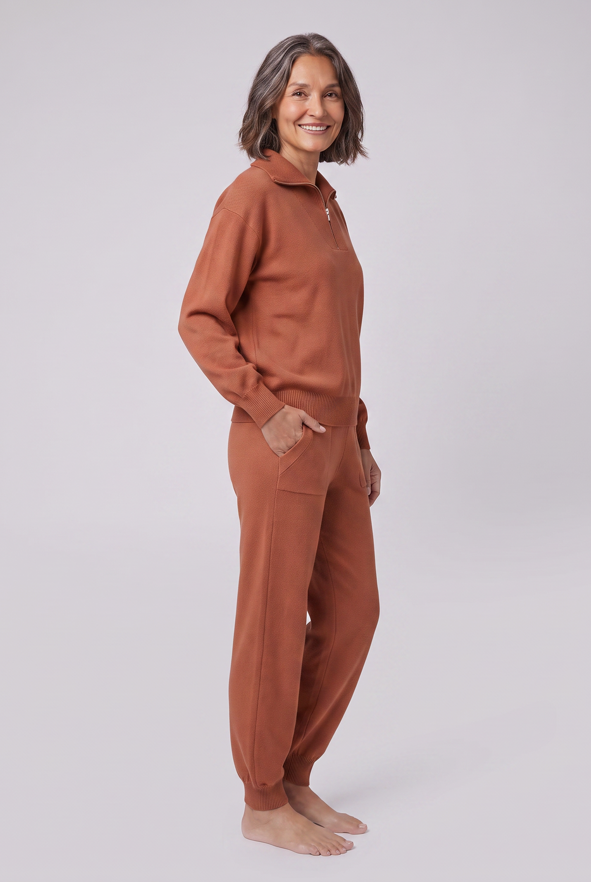 Fjorda half-zip knit lounge set in rust, side view on model