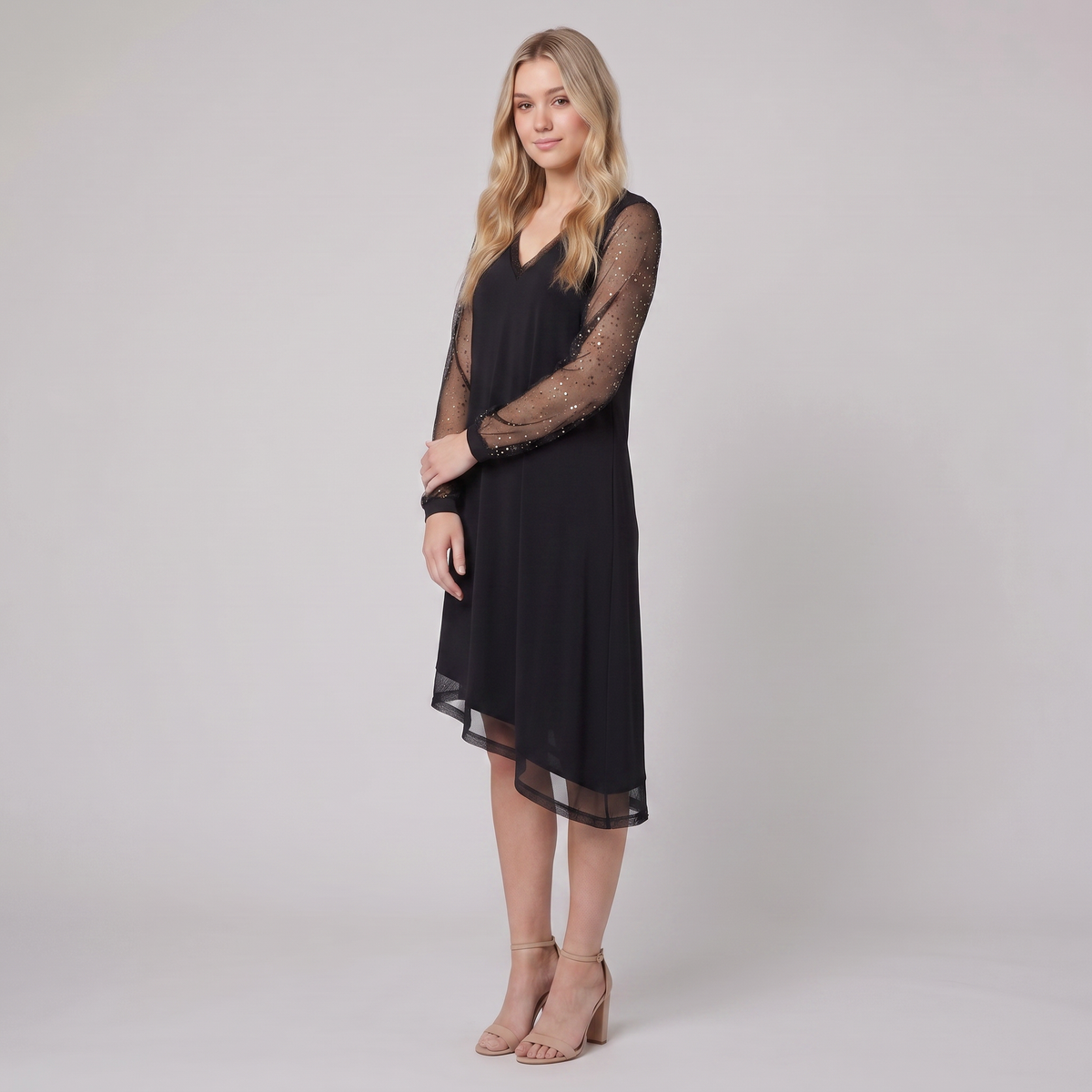 Genevieve sheer sleeve evening dress in black, three-quarter view on model