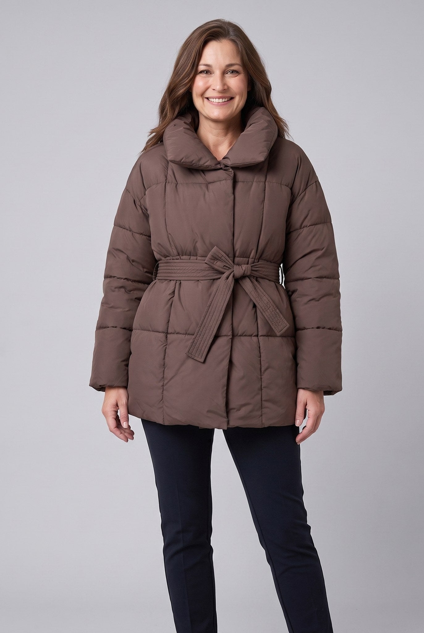 Haven belted puffer coat in brown on model