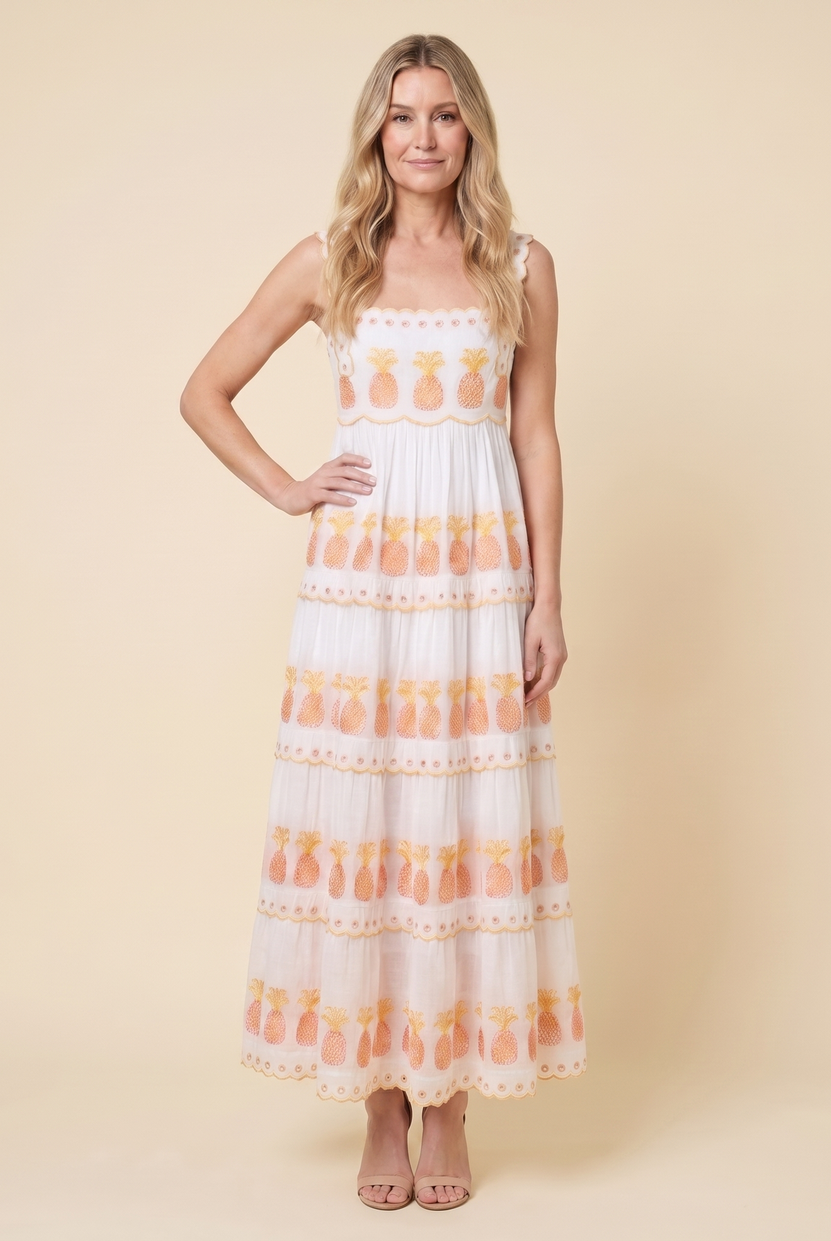 Women's white square-neck tiered maxi dress with pineapple embroidery, full-length front view on model