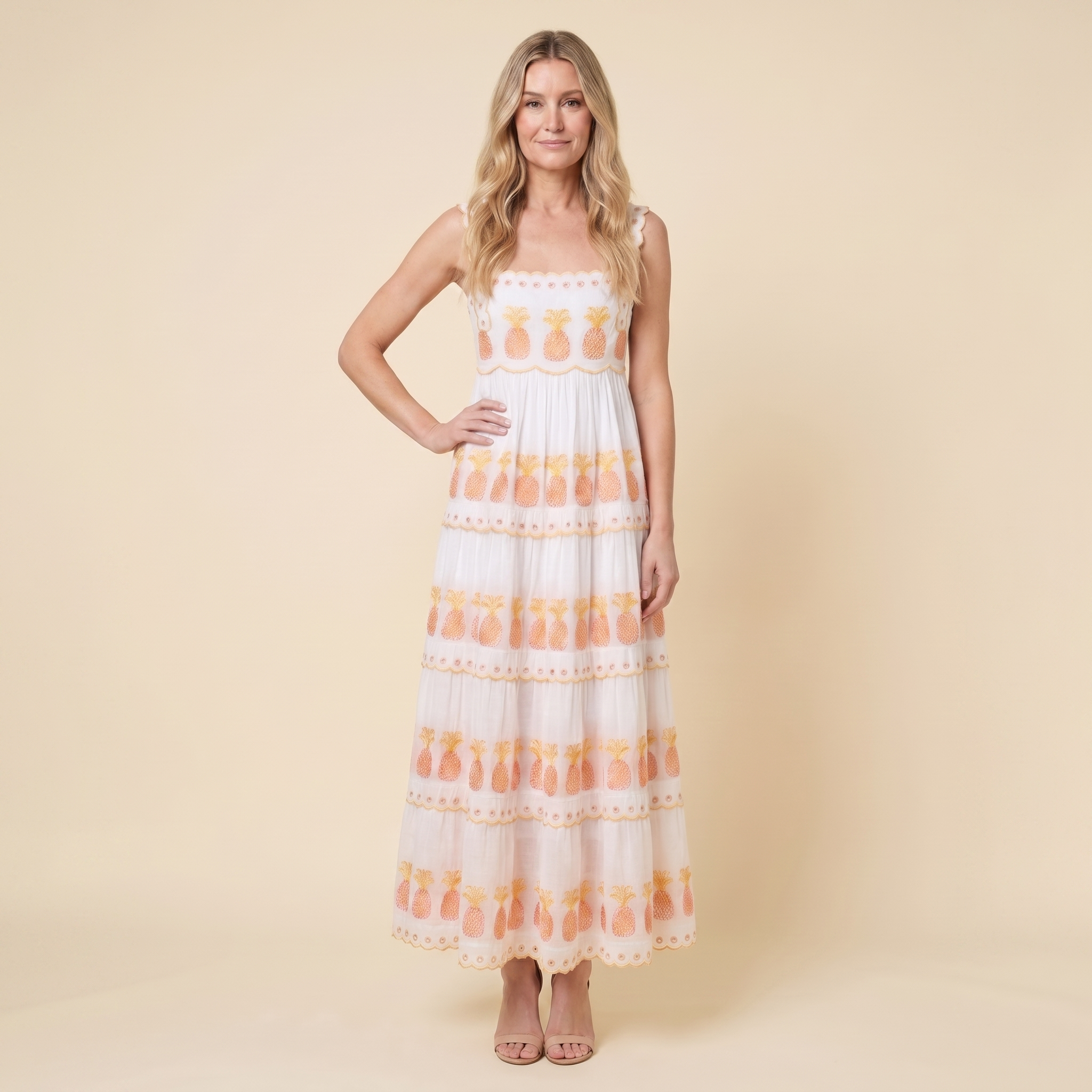 Women's white square-neck tiered maxi dress with pineapple embroidery, full-length front view on model