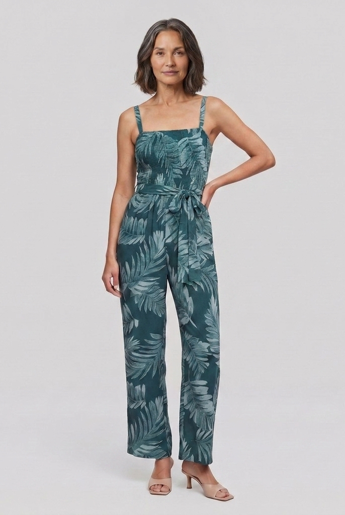 Women's teal spaghetti strap wide-leg jumpsuit with smocked bodice, front view on model