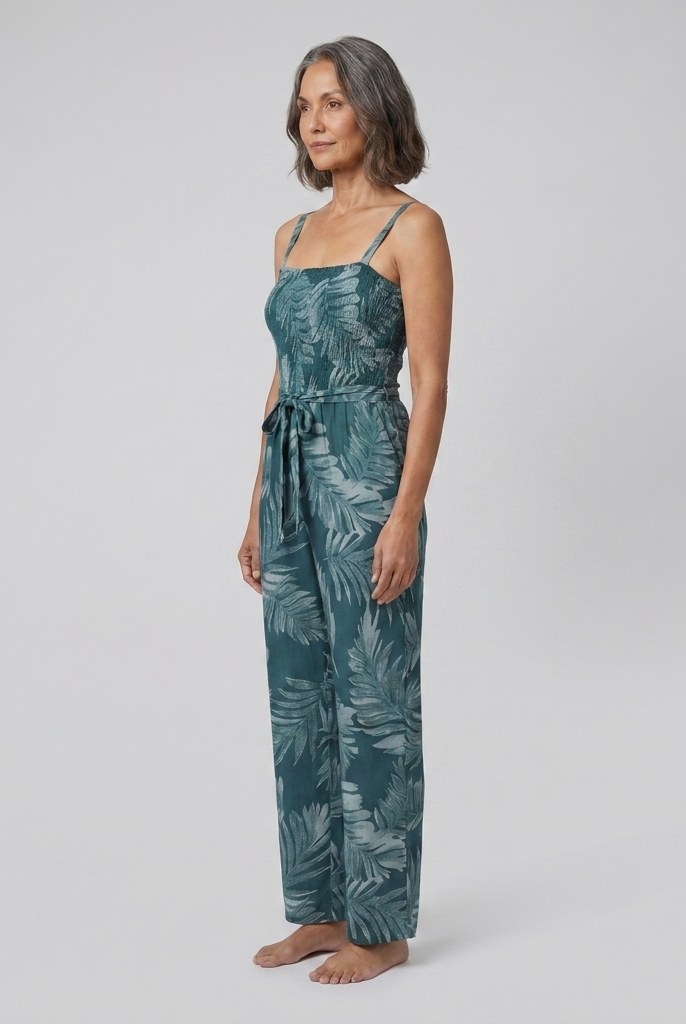 Teal spaghetti strap jumpsuit, three-quarter side view on model