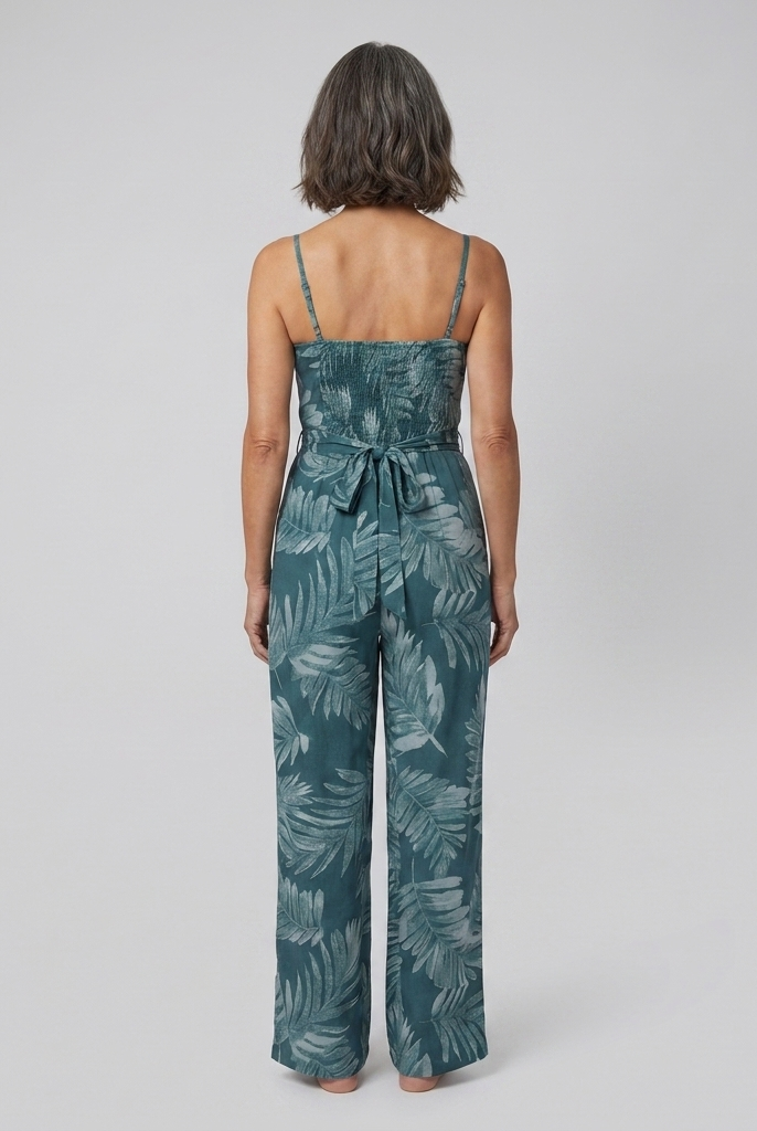 Teal wide-leg jumpsuit with smocked bodice, back view on model