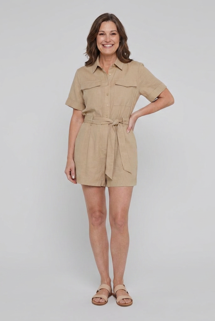 Women's beige utility shirt romper with tie waist, front view on model