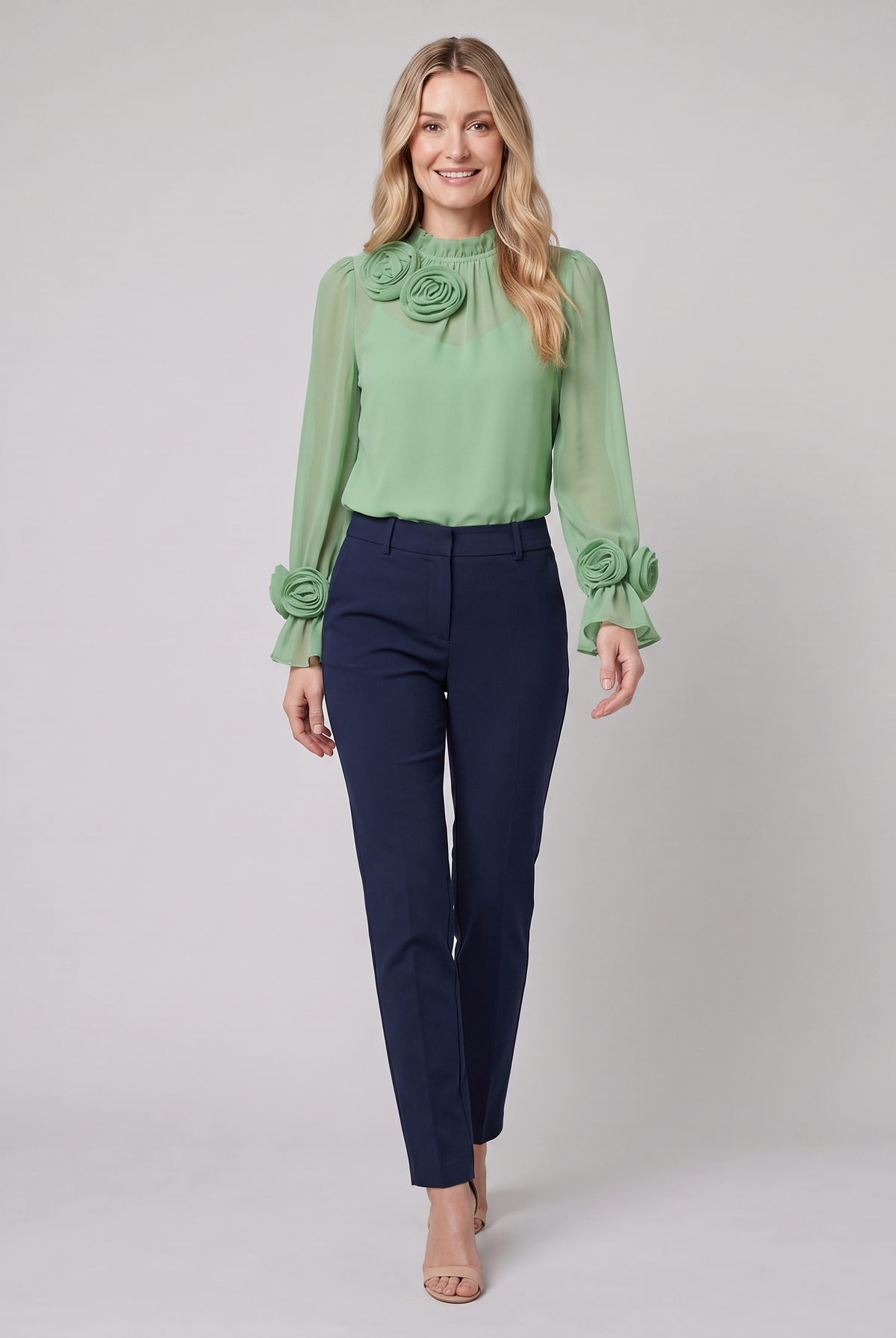 Iona sheer chiffon blouse with 3D rosettes in green on model