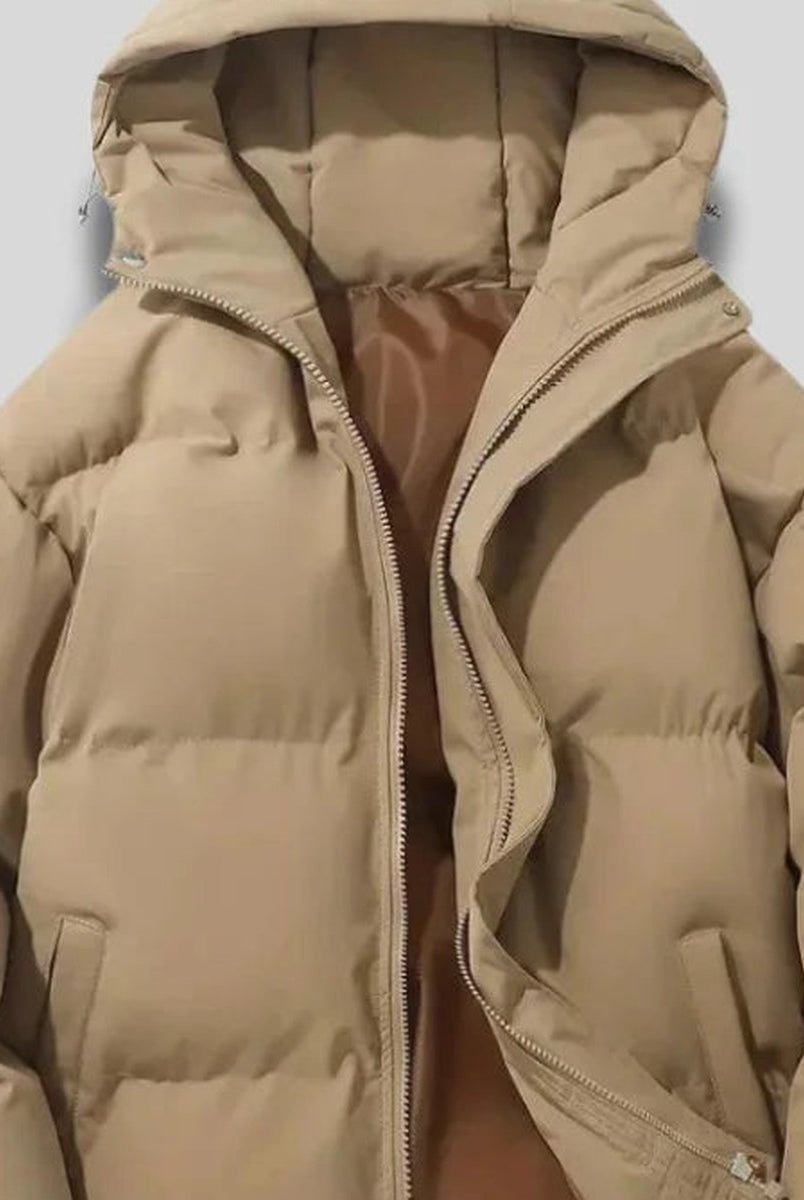 Close-up of women's beige hooded puffer jacket