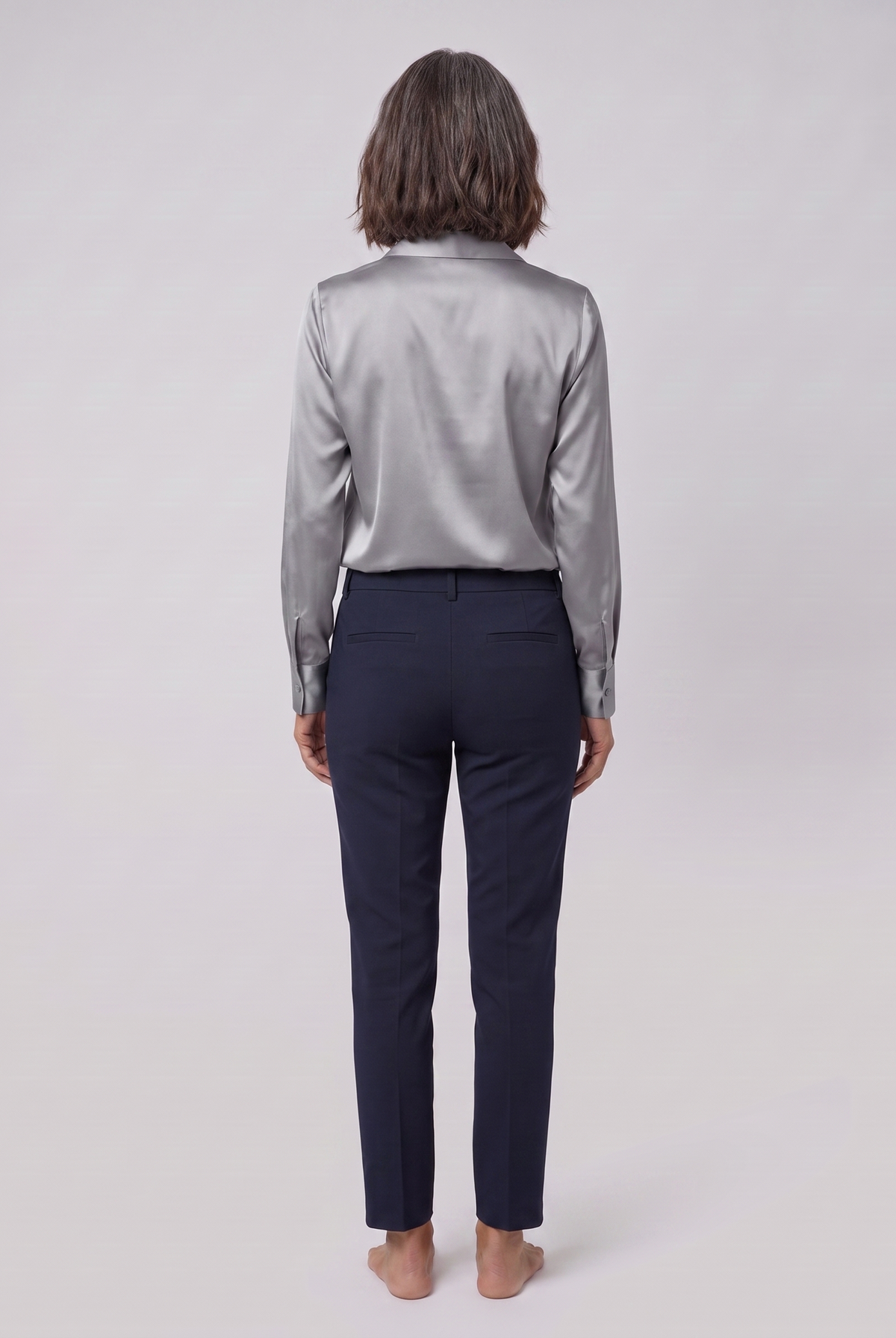 Lena metallic V-neck blouse in silver, back view on model