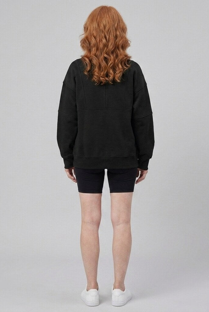 Paloma oversized half-zip sweatshirt in jet black on model