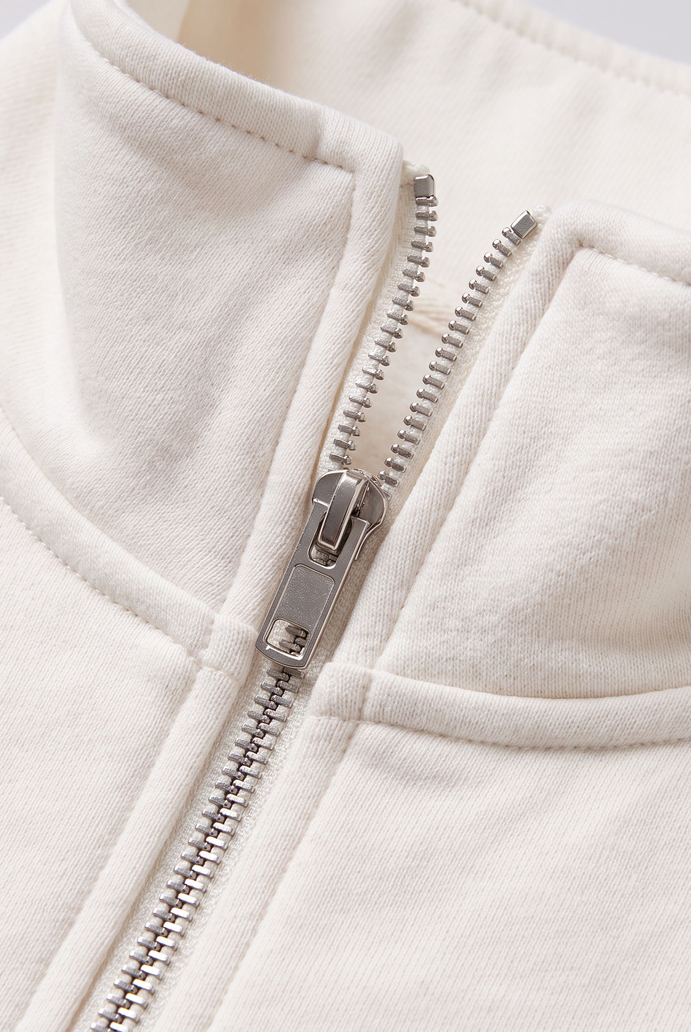 Paloma half-zip sweatshirt collar and zip close-up