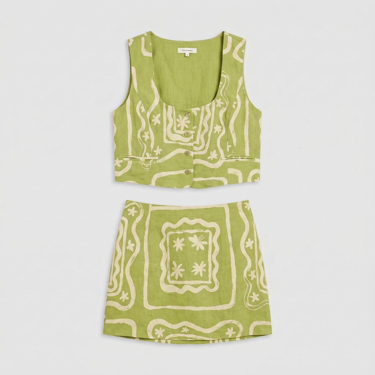 Lime green linen co-ord set, product flat-lay of vest top and mini skirt