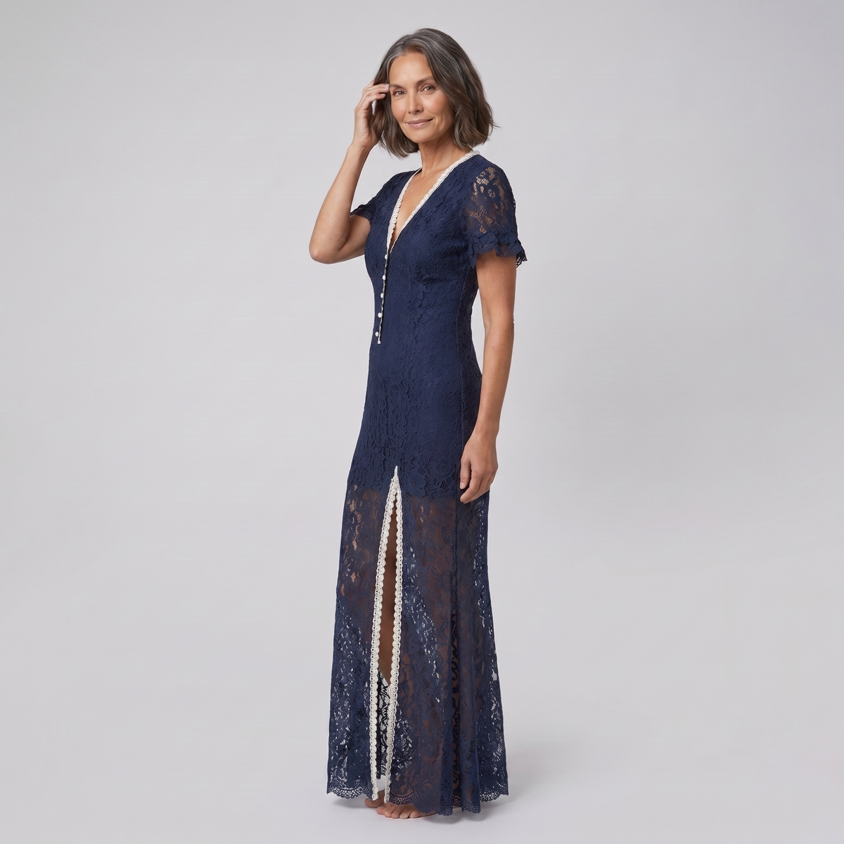 Bora Midi Dress in navy floral lace, model three-quarter side view — side
