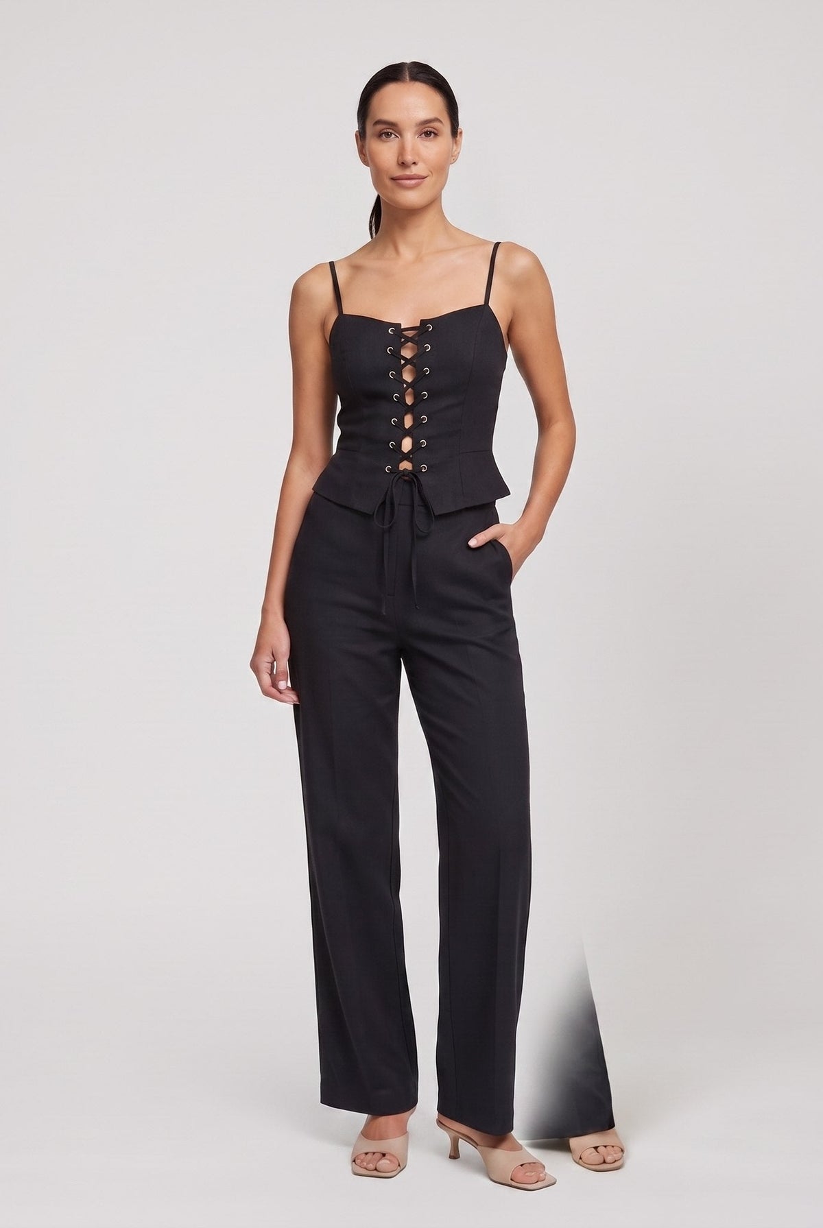 Black lace-up corset top and wide-leg trouser set, front view