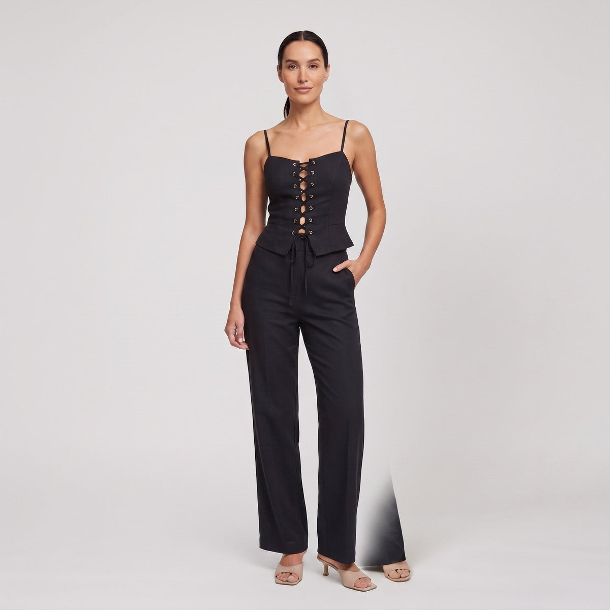Black lace-up corset top and wide-leg trouser set, front view