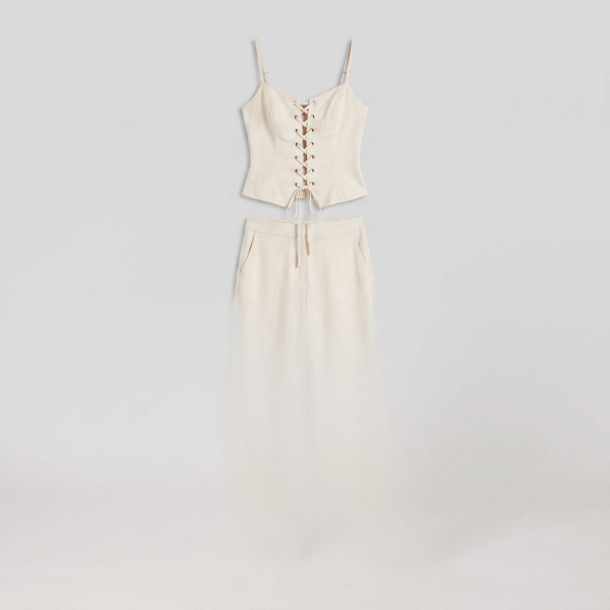 Cream lace-up corset top and wide-leg trouser set, product flat-lay