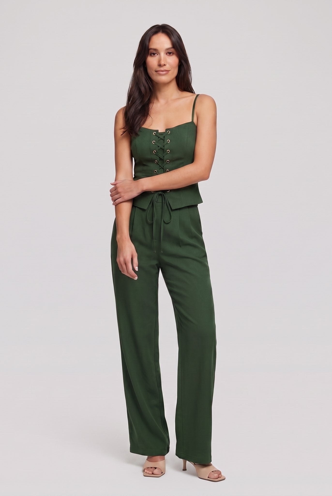 Forest green lace-up corset top and wide-leg trouser set, front view