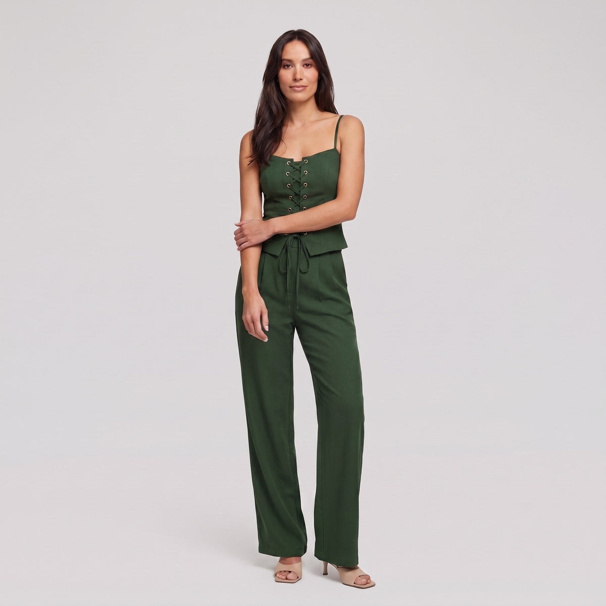 Forest green lace-up corset top and wide-leg trouser set, front view