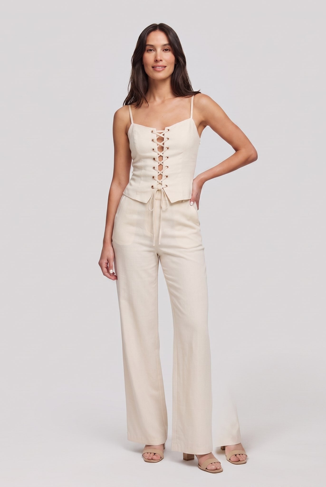 Cream lace-up corset top and wide-leg trouser set, front view
