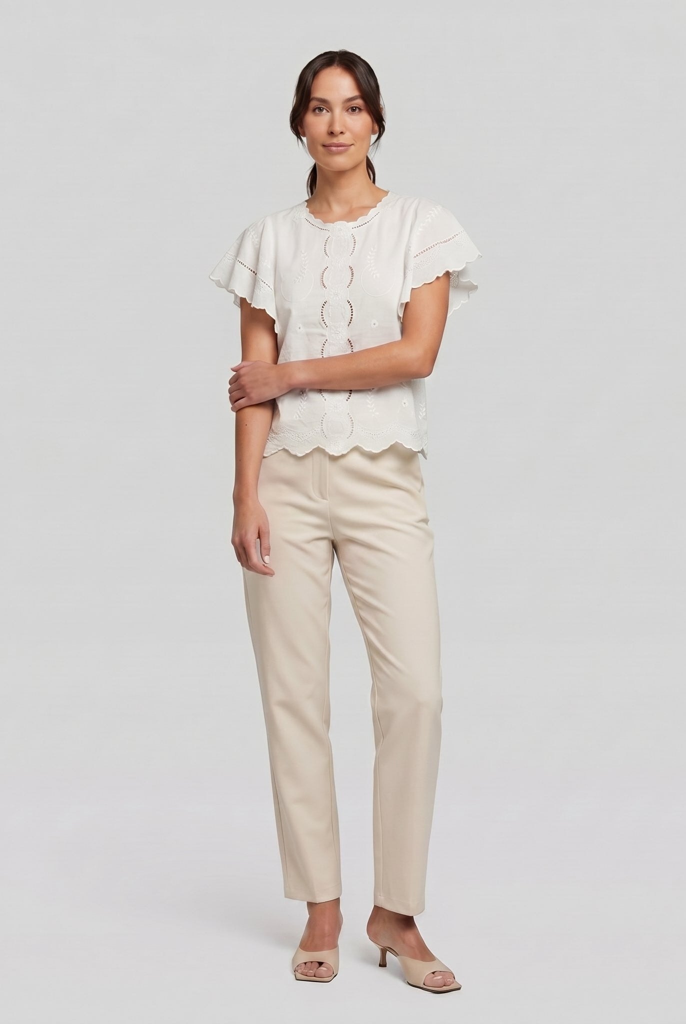 Pamela Boutique white broderie blouse, model side pose