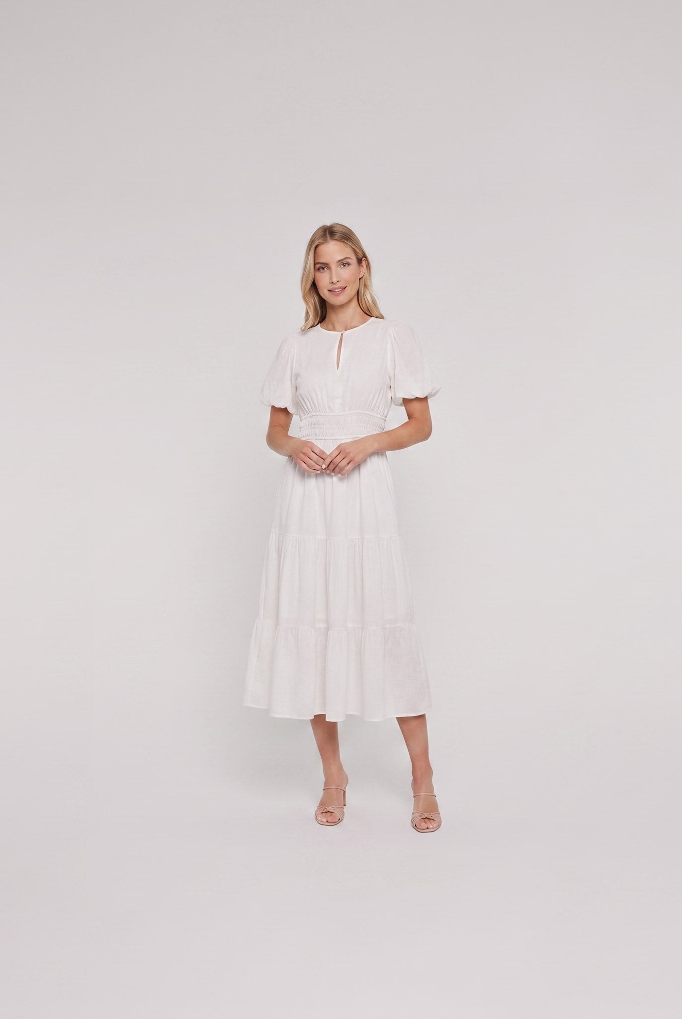 White cotton midi dress with keyhole neckline, full-length on model