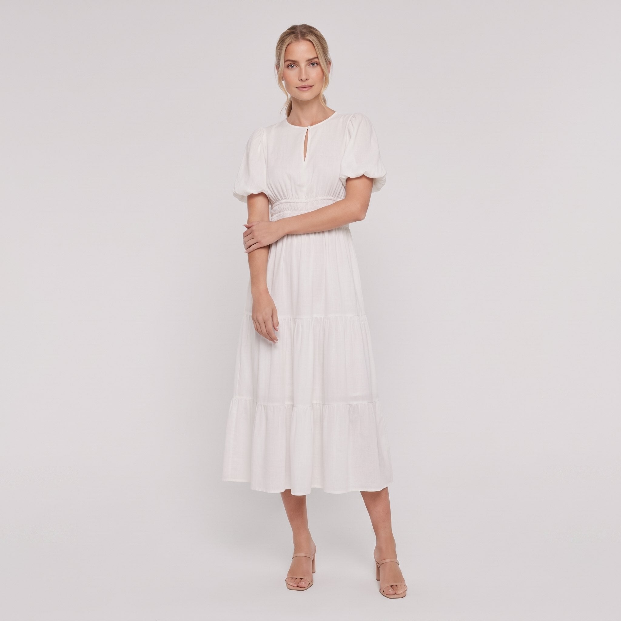 White tiered cotton midi dress, side pose on model