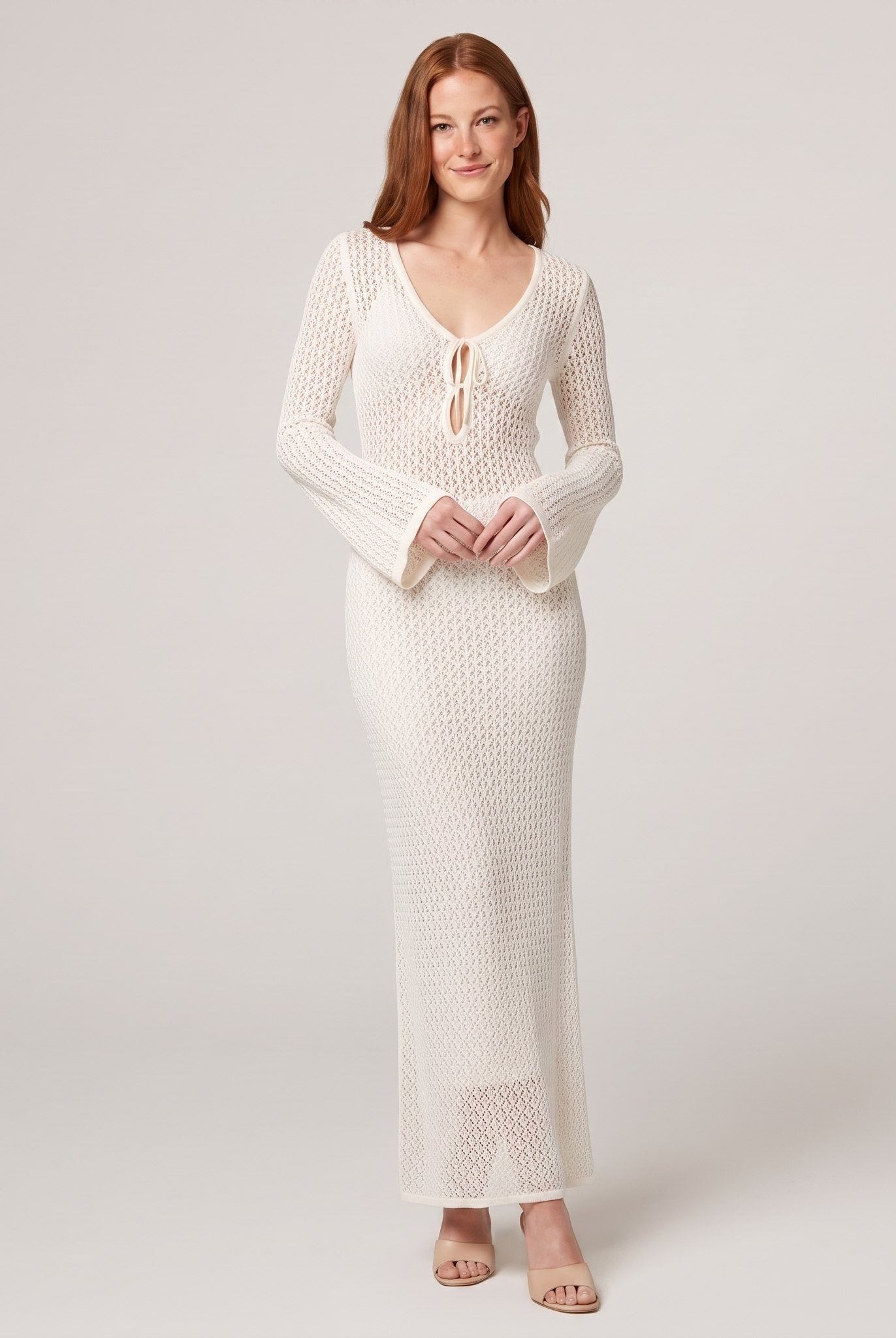 Ivory crochet maxi dress with V-neck tie front, full-length on model