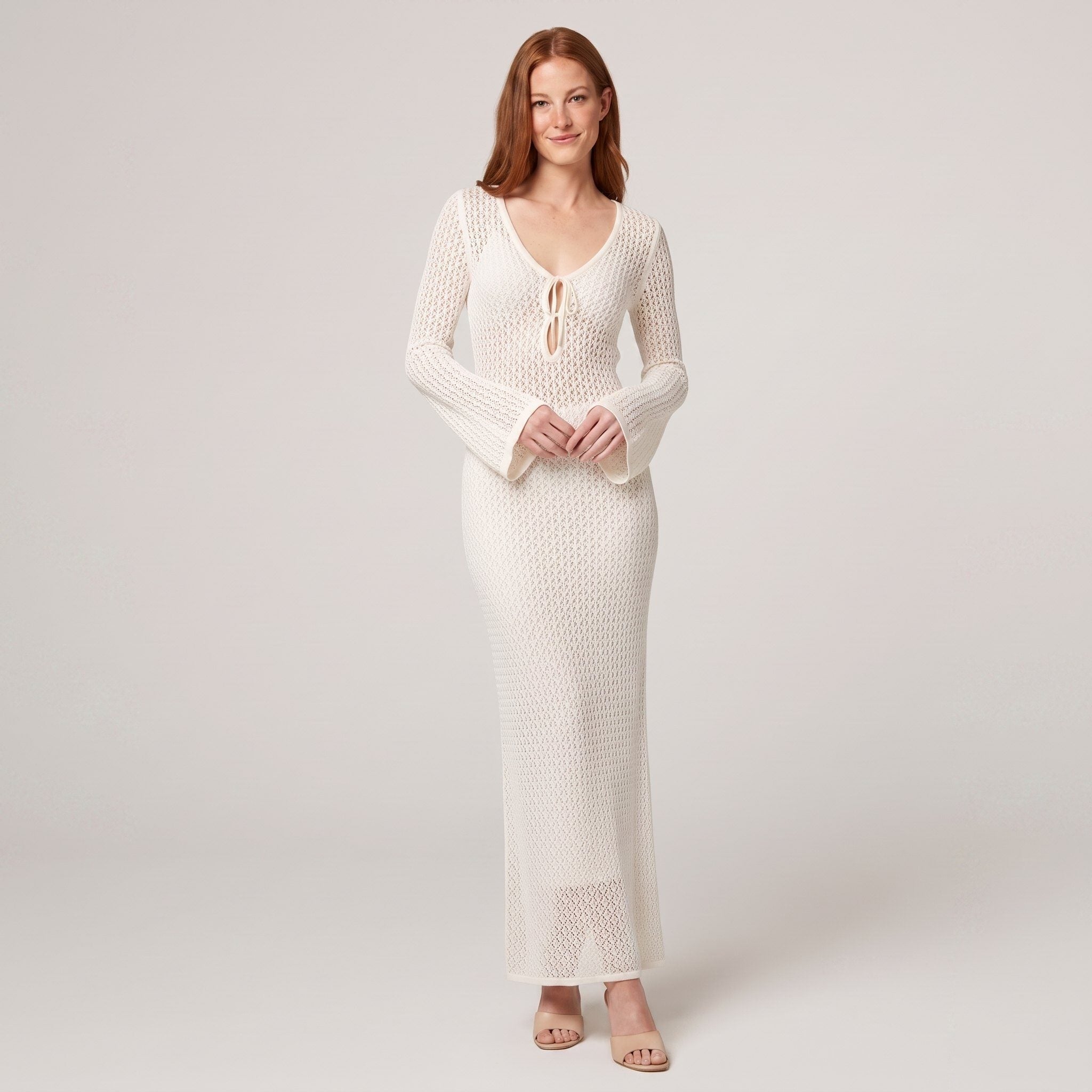 Ivory crochet maxi dress with V-neck tie front, full-length on model