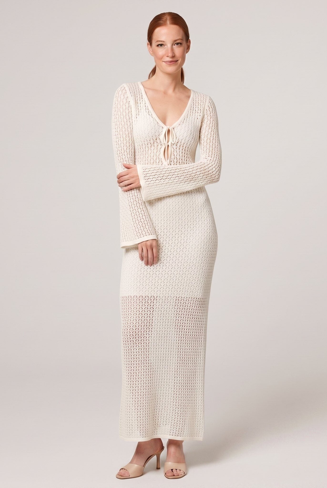 Ivory crochet knit maxi dress, side pose on model