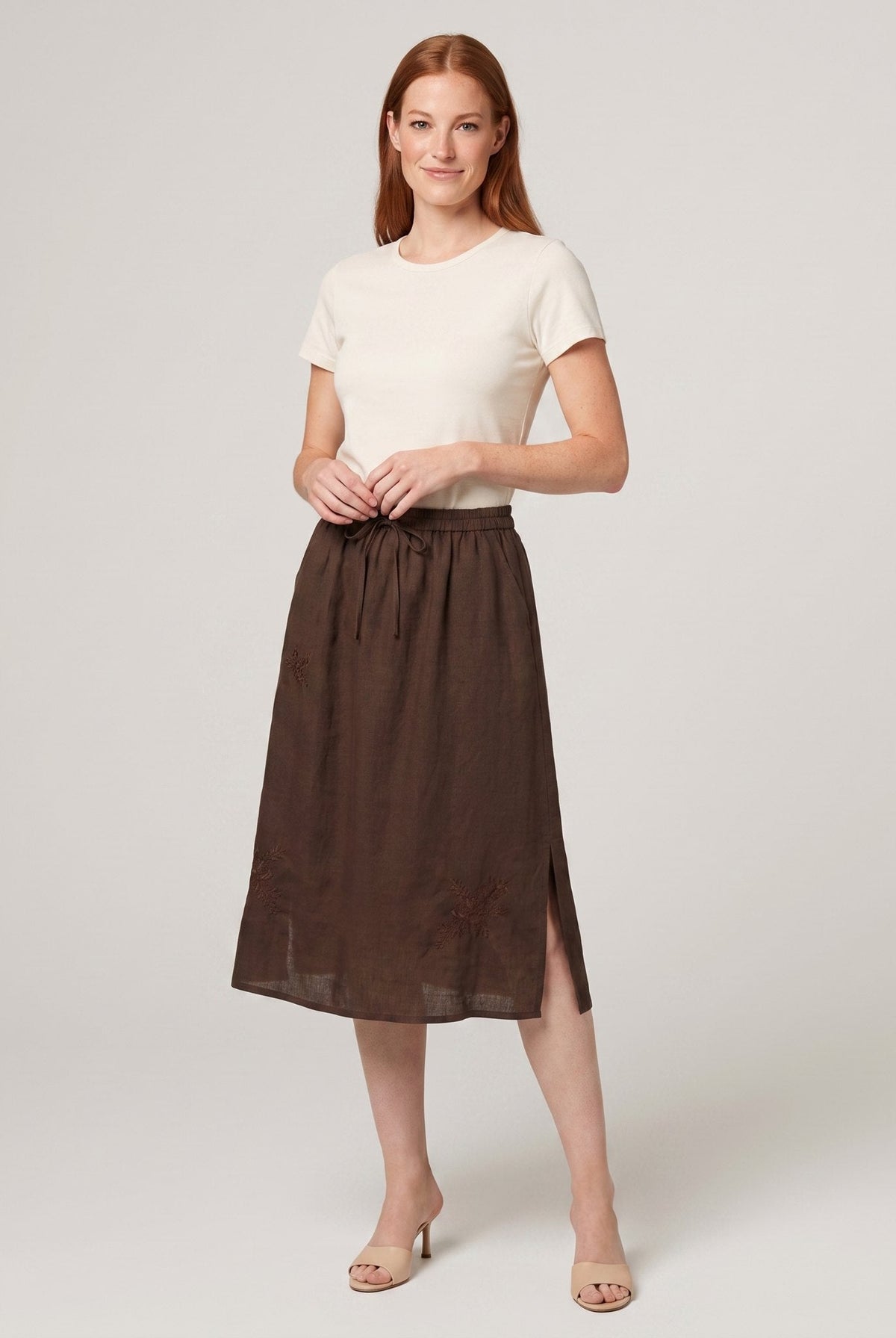 Coffee brown linen A-line knee-length drawstring skirt, front view on model