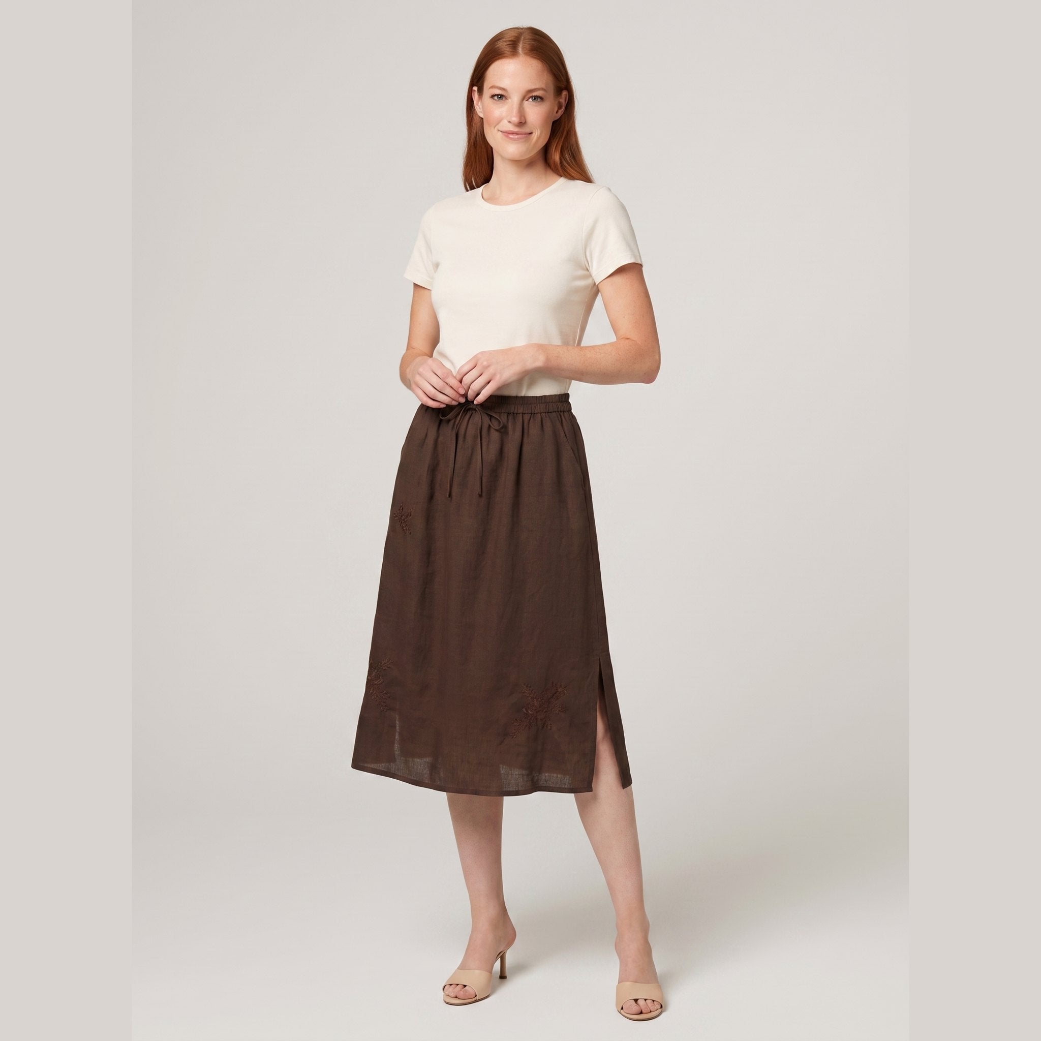 Coffee brown linen A-line knee-length drawstring skirt, front view on model