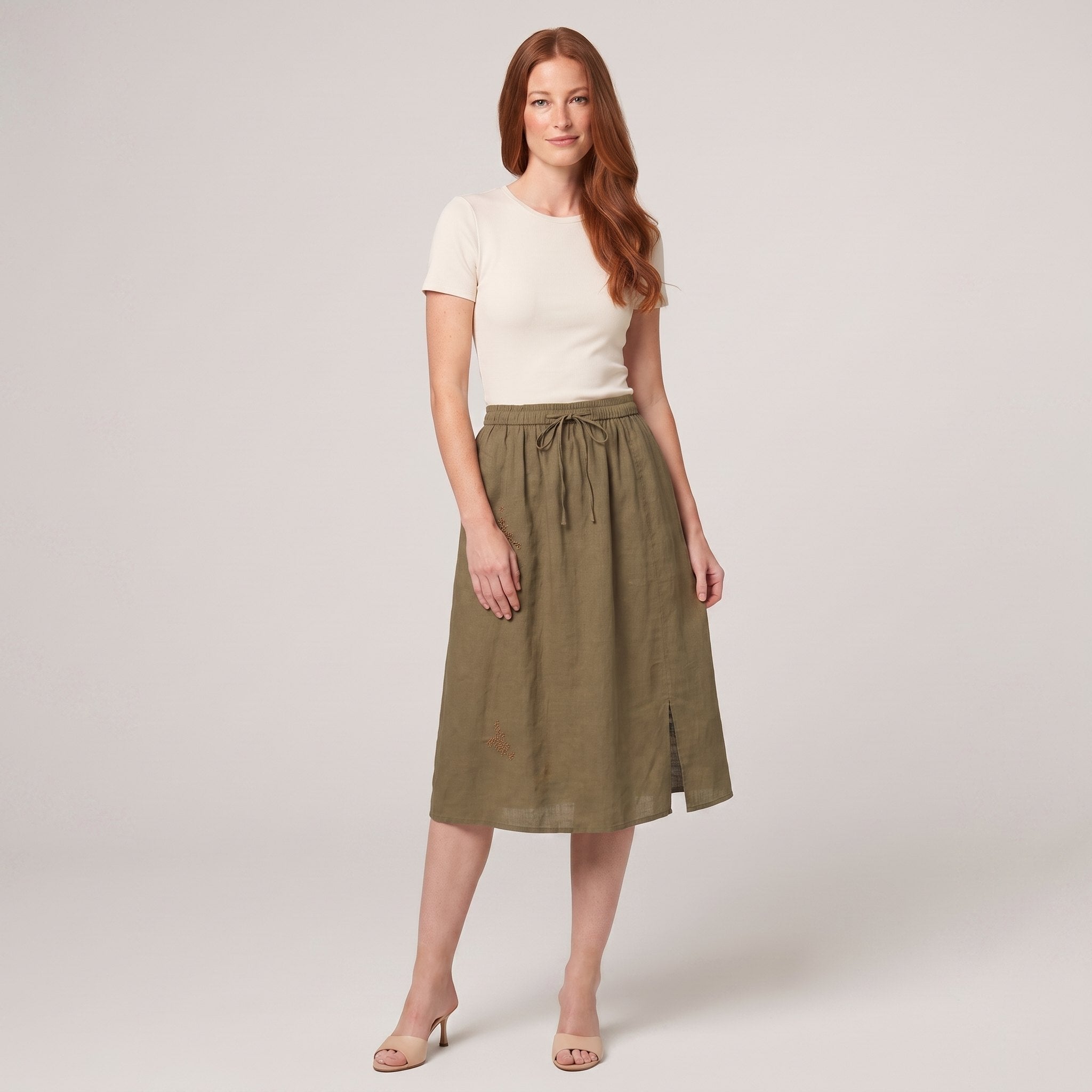 Khaki green linen A-line knee-length drawstring skirt, front view on model