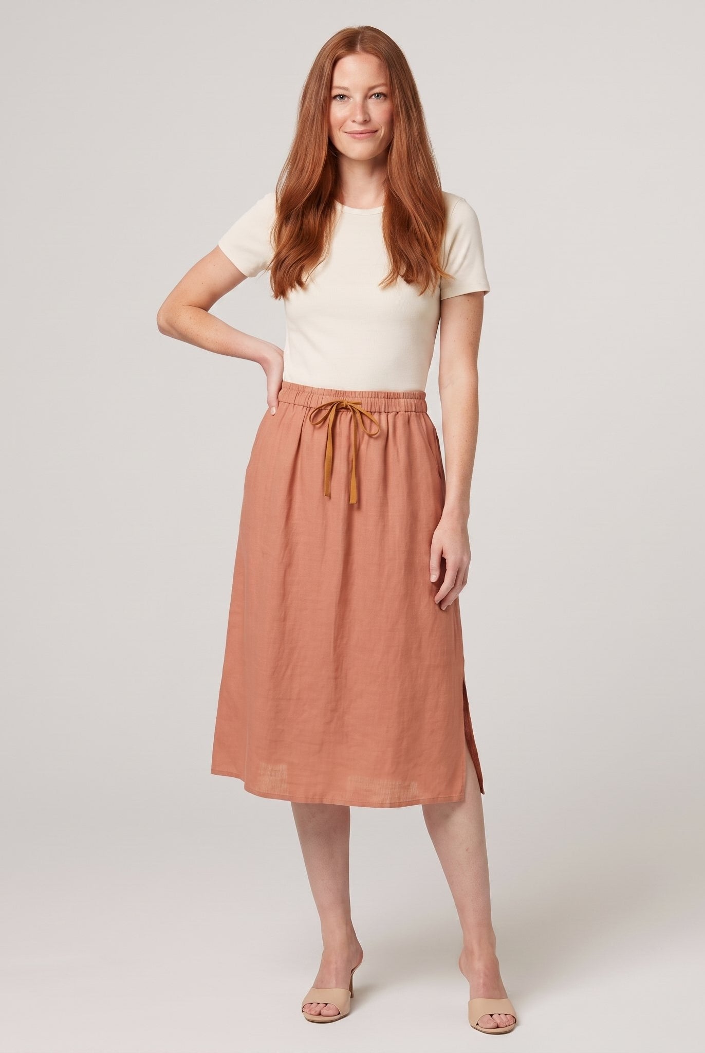 Peach linen A-line knee-length drawstring skirt, front view on model