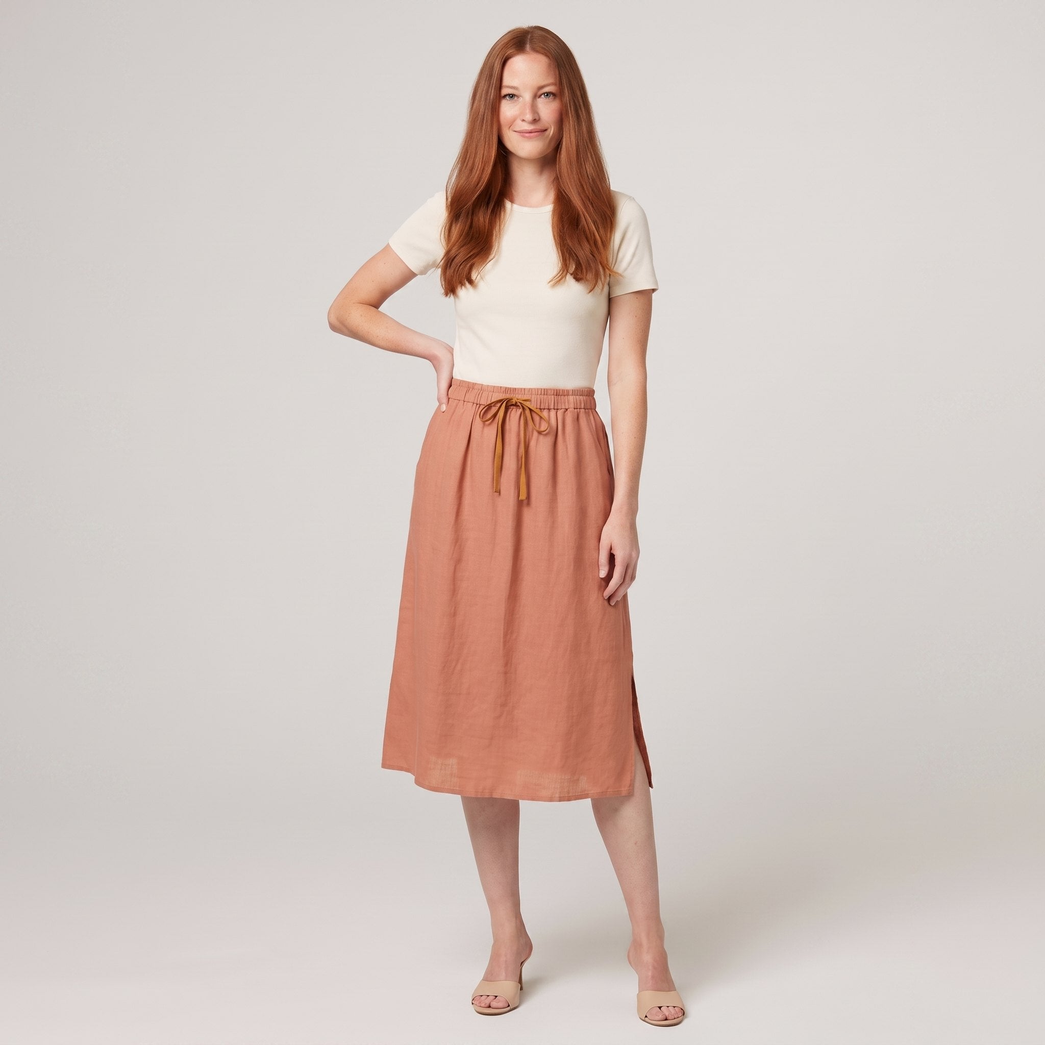 Peach linen A-line knee-length drawstring skirt, front view on model