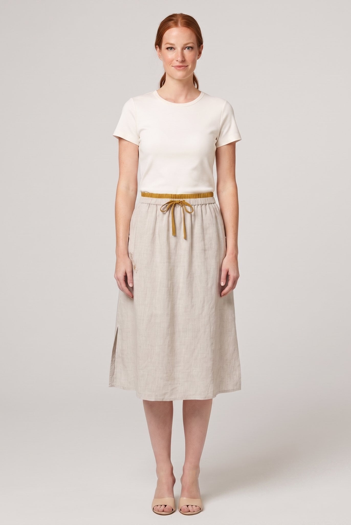 Natural linen A-line knee-length drawstring skirt, front view on model