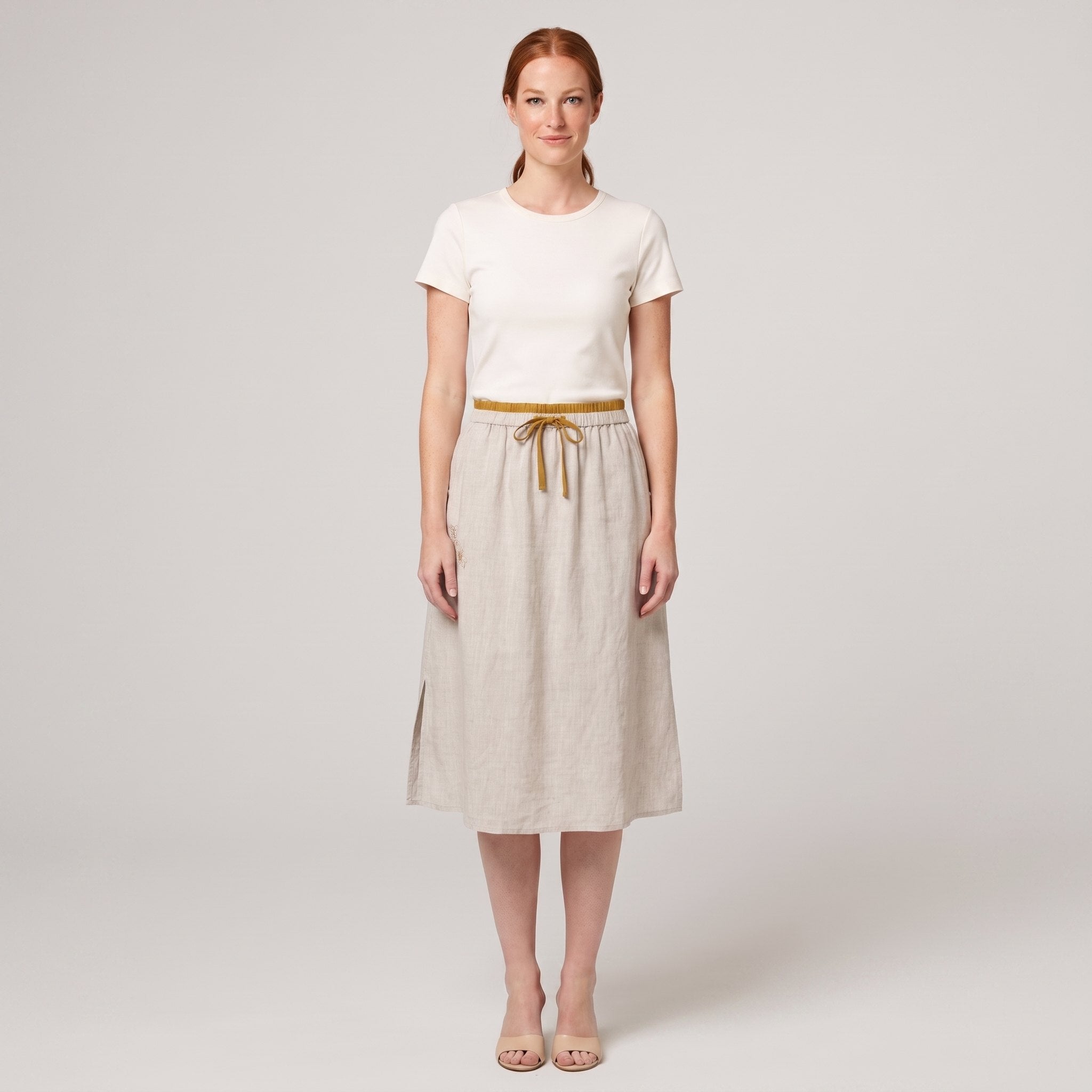 Natural linen A-line knee-length drawstring skirt, front view on model