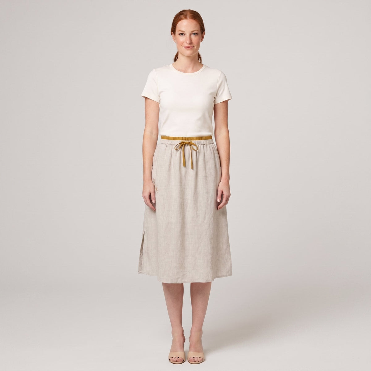 Natural linen A-line knee-length drawstring skirt, front view on model