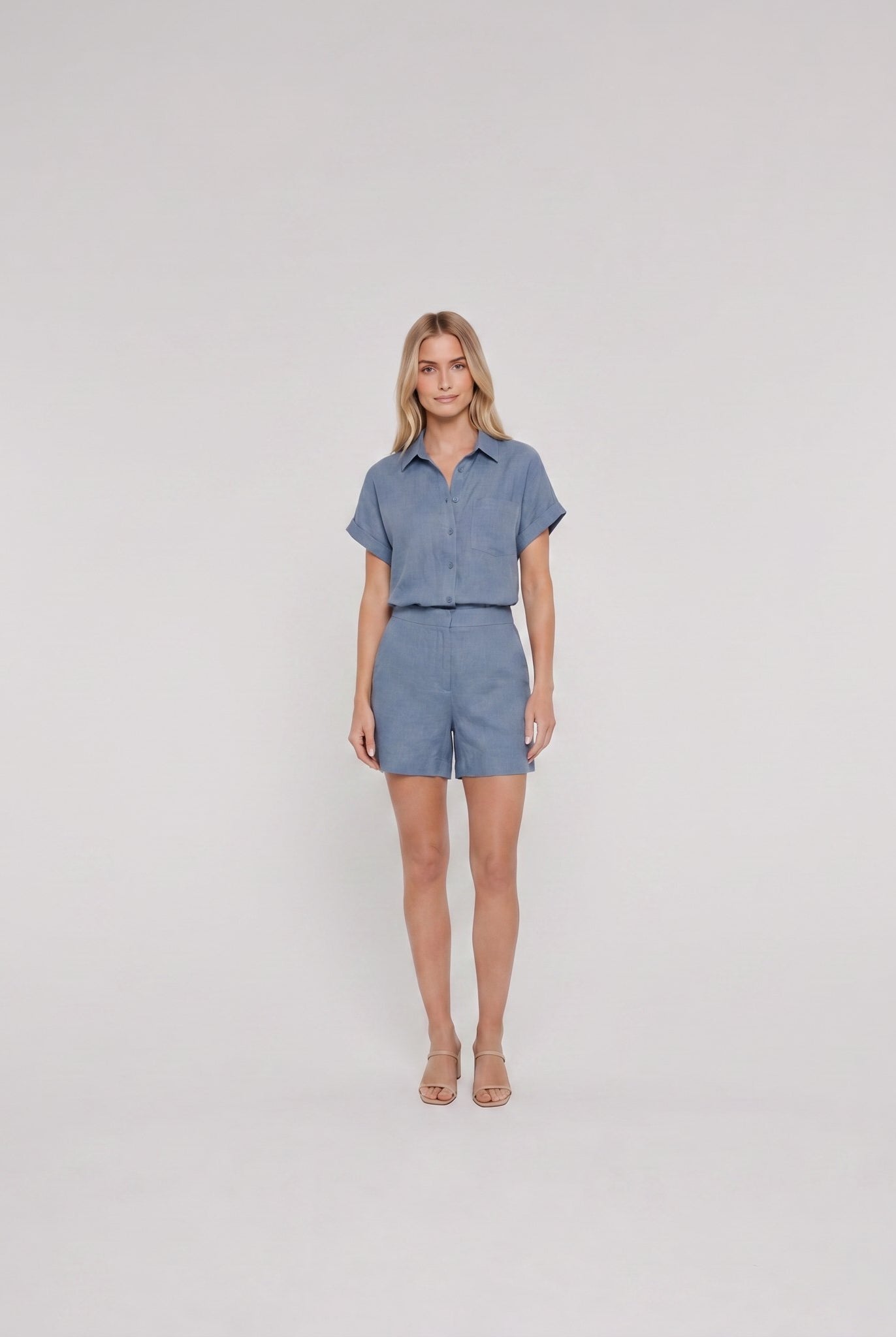 Chambray blue linen camp-collar shirt and high-waist shorts set, front view on model