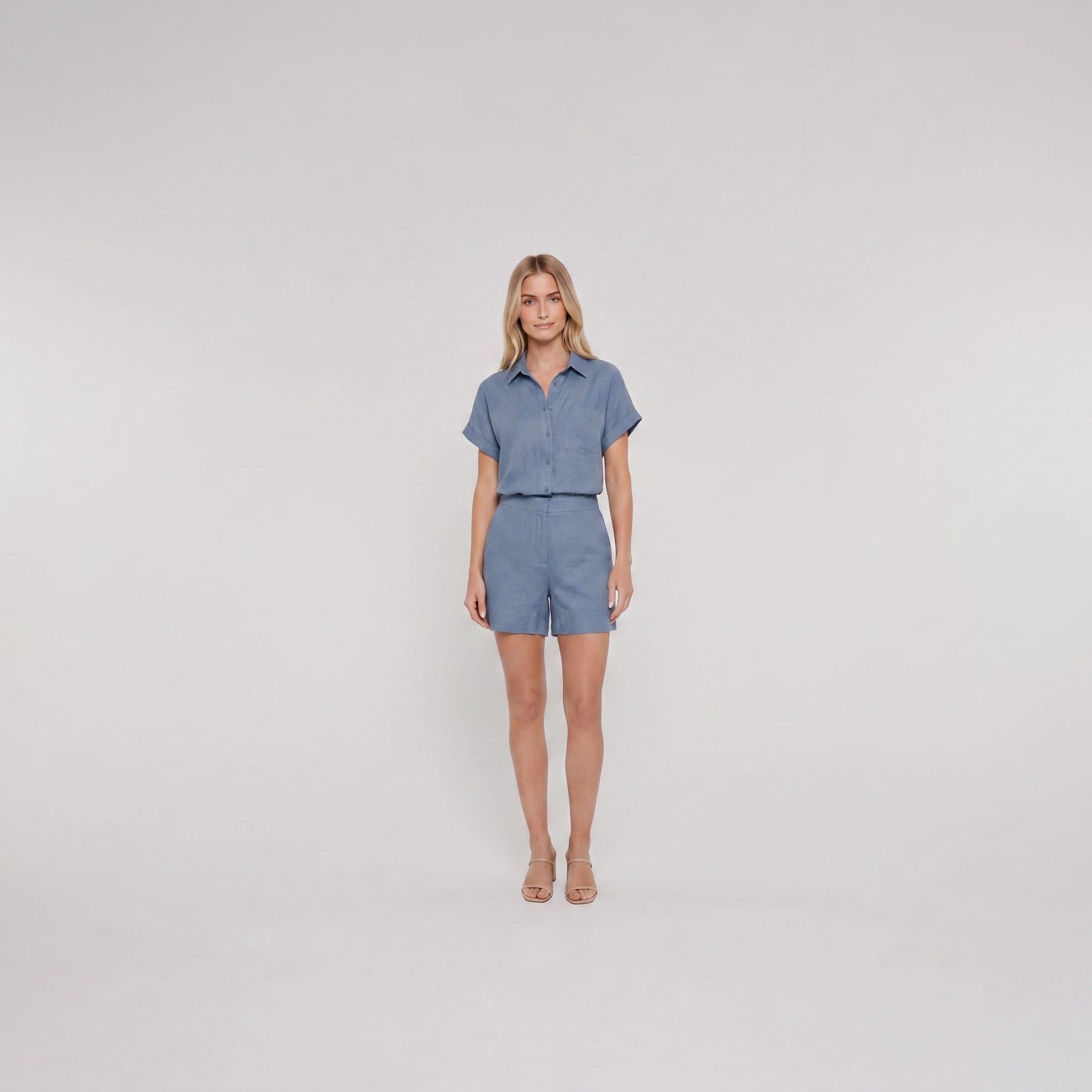 Chambray blue linen camp-collar shirt and high-waist shorts set, front view on model