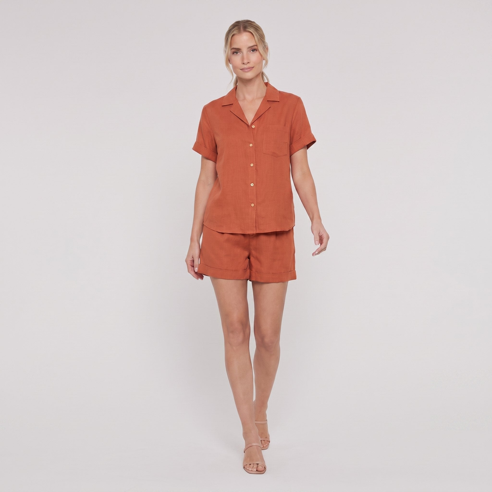Rust orange linen camp-collar shirt and high-waist shorts set, front view on model
