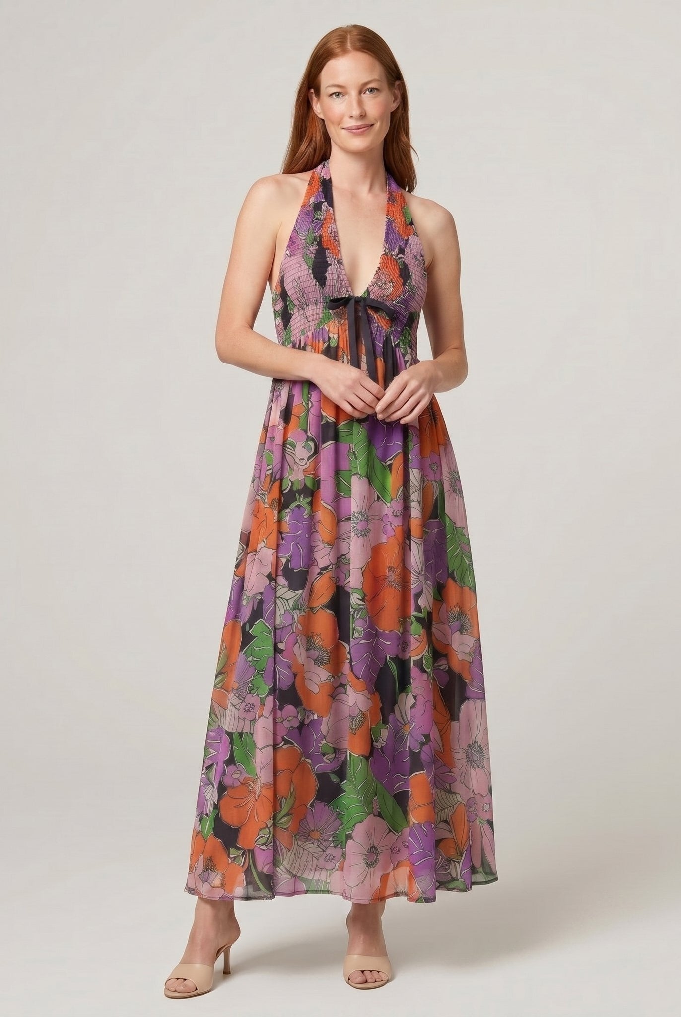 Fiona Maxi Dress in Tropical floral print - navy halter-neck maxi dress with orange and purple flowers on model