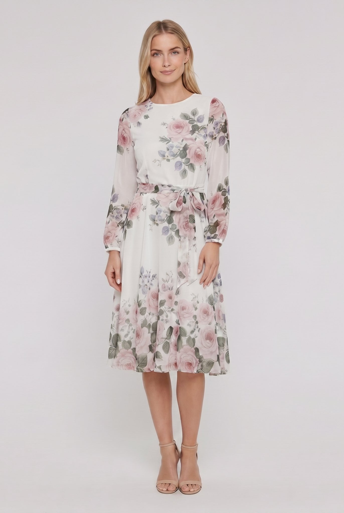 Model wearing white floral A-line midi dress with tie belt, front view