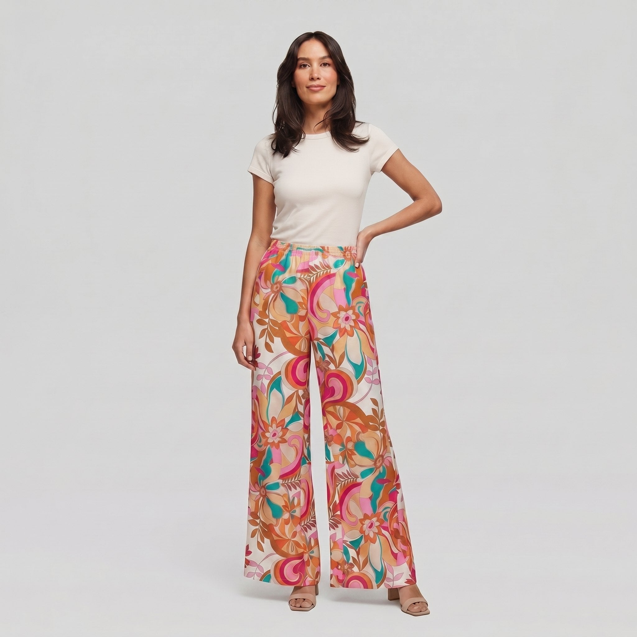 Pamela Boutique pink floral wide-leg flared trousers, model front view