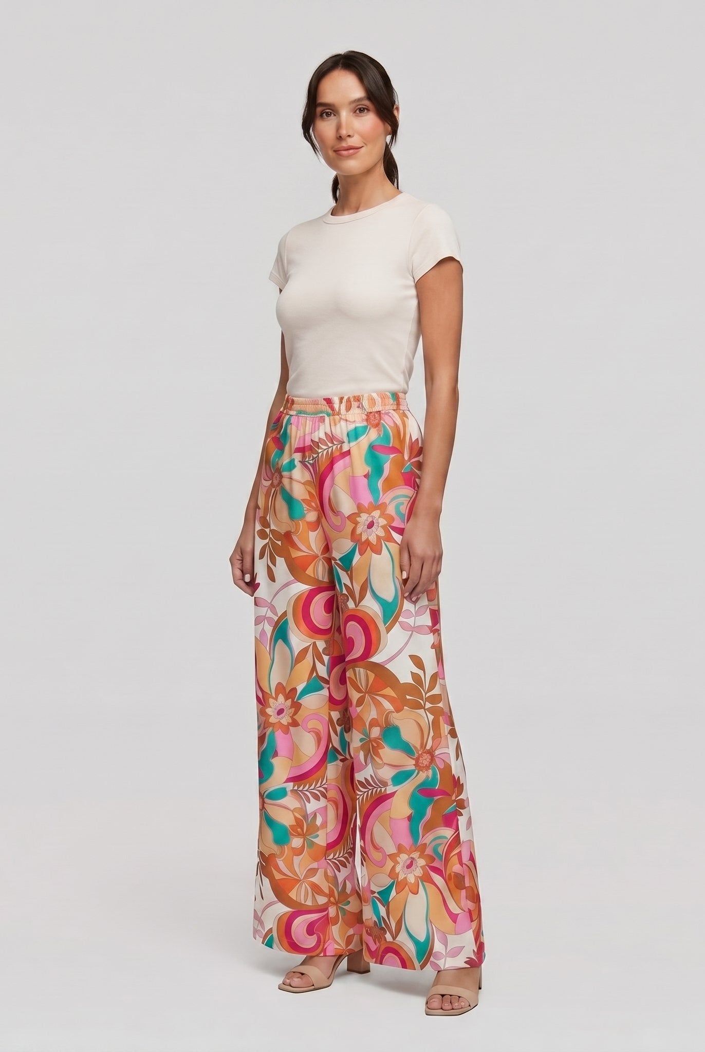 Pamela Boutique pink floral wide-leg flared trousers, model angle pose