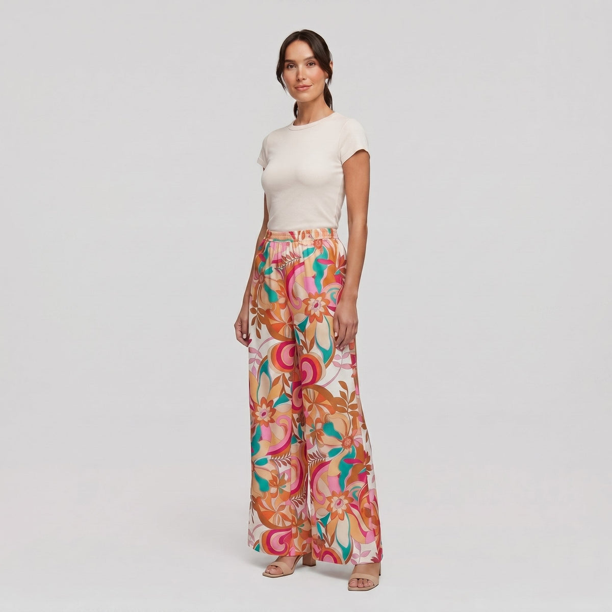 Pamela Boutique pink floral wide-leg flared trousers, model angle pose