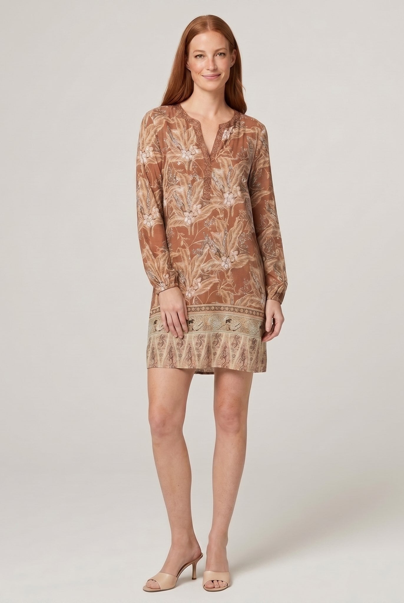 Model wearing brown floral V-neck long-sleeve shift mini dress, front view