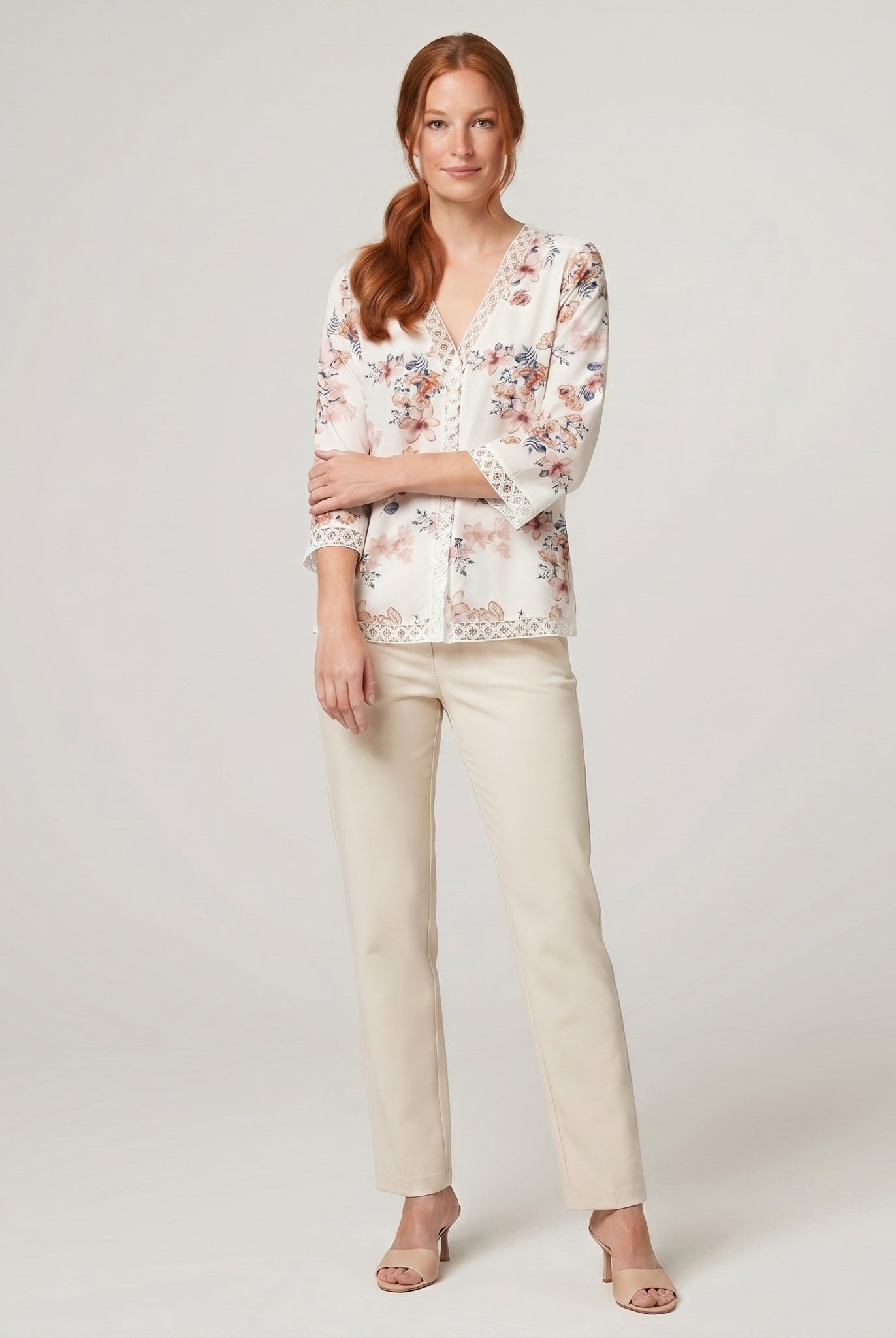 Pamela Boutique floral V-neck blouse, model side pose