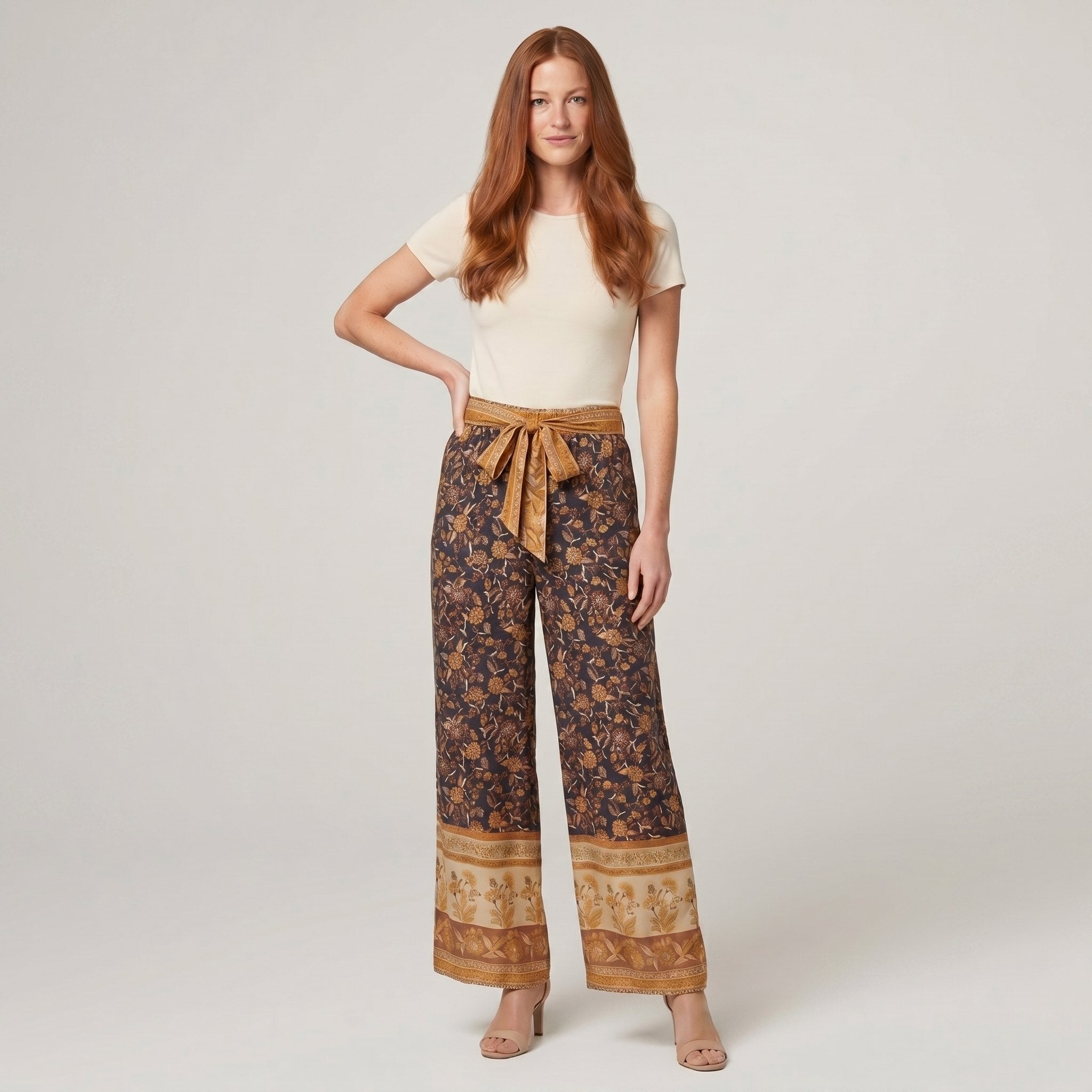 Pamela Boutique brown floral wide-leg trousers with tie belt, model front view