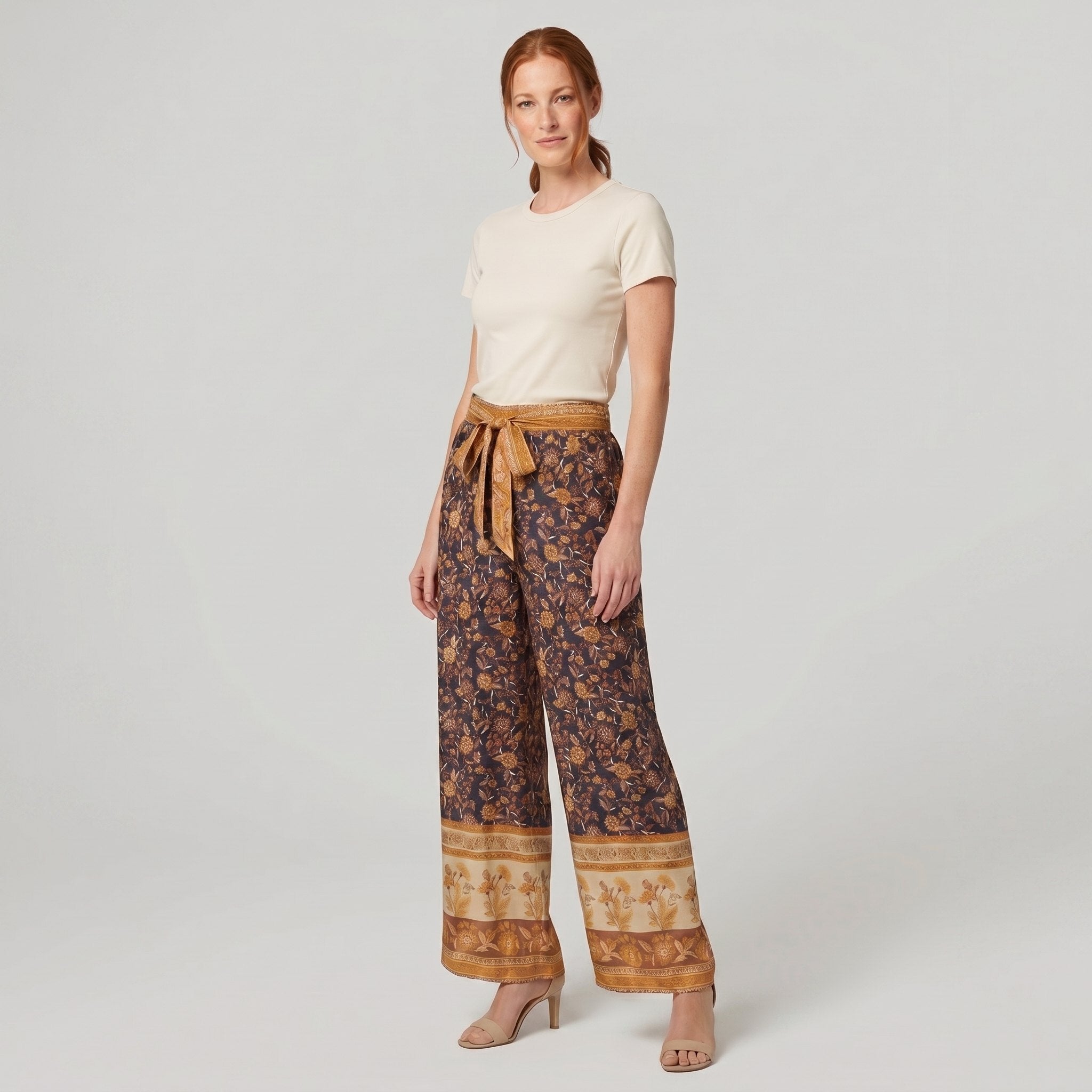 Pamela Boutique brown floral wide-leg trousers, model angle pose